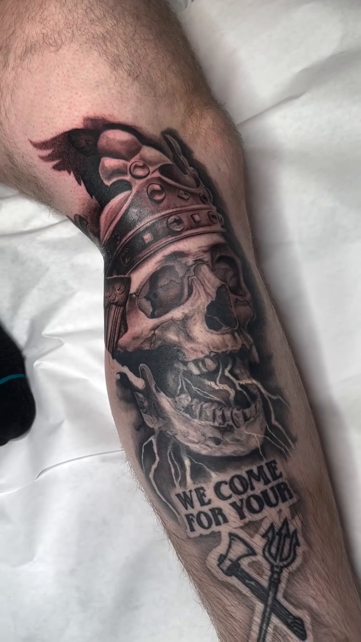 Skull with crown and raven dark realism tattoo by Adrian Dominguez, Las Vegas, Nevada
