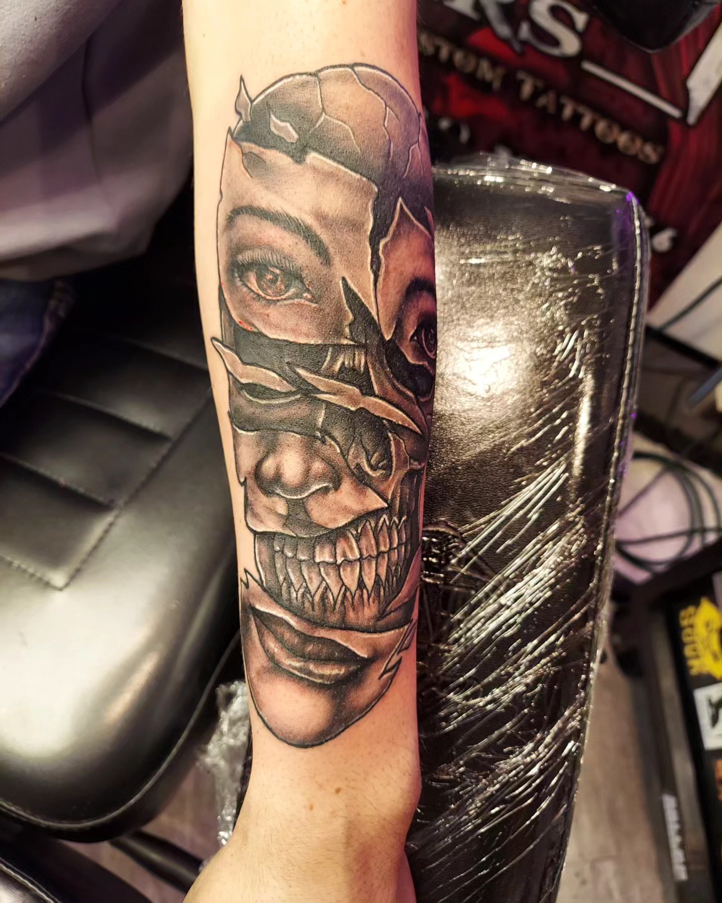 Skull and woman realism tattoo on the forearm by Dave Johnson, Billings, Montana