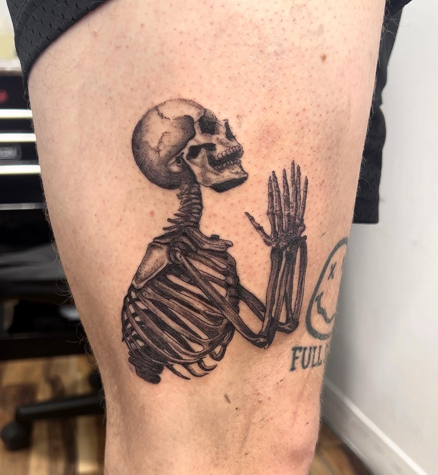 Skeleton black and grey tattoo on the thigh by Eduardo Chaparro