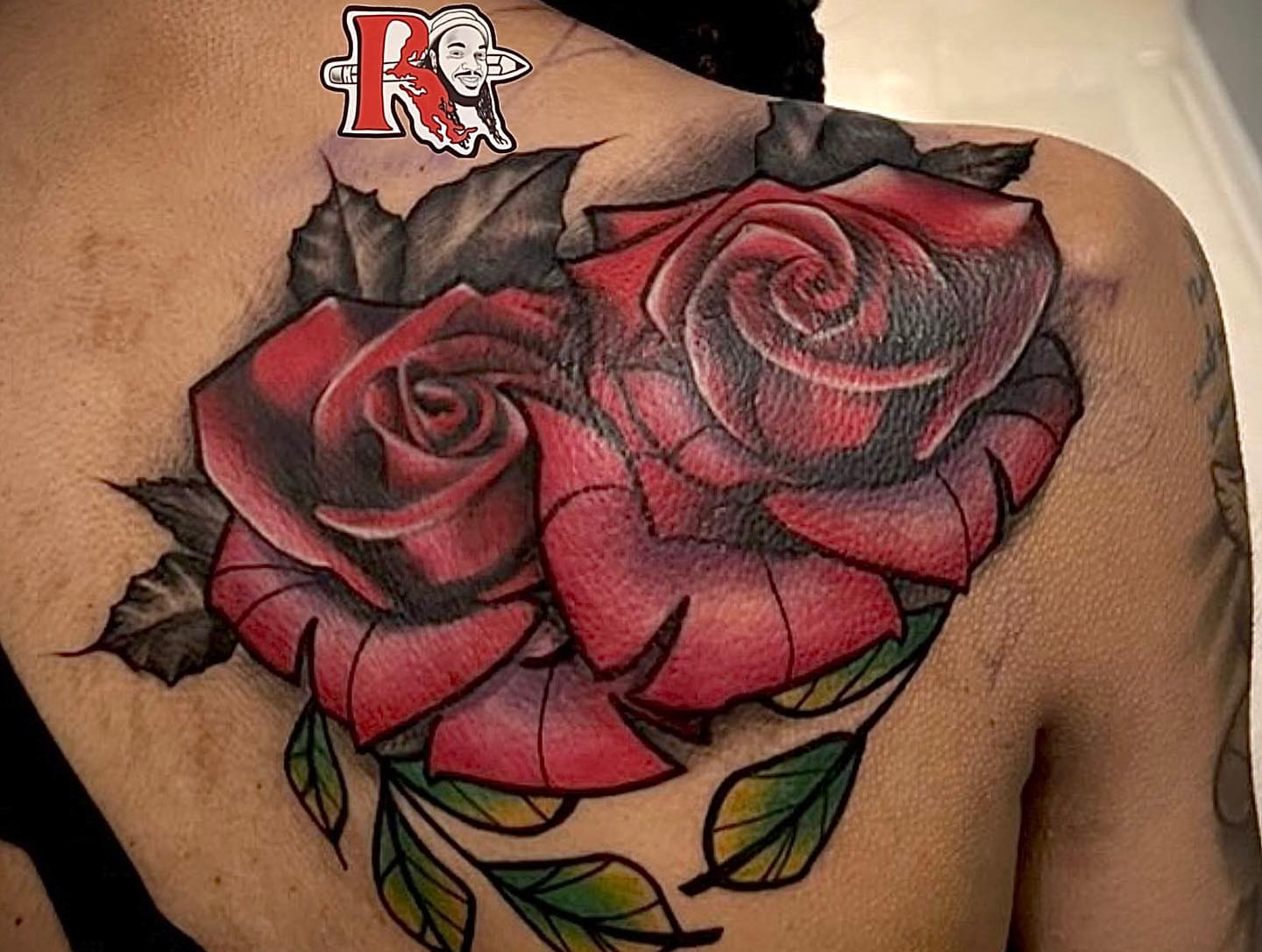 Red roses realism tattoo on the shoulder by Chicago Tattoo Artist