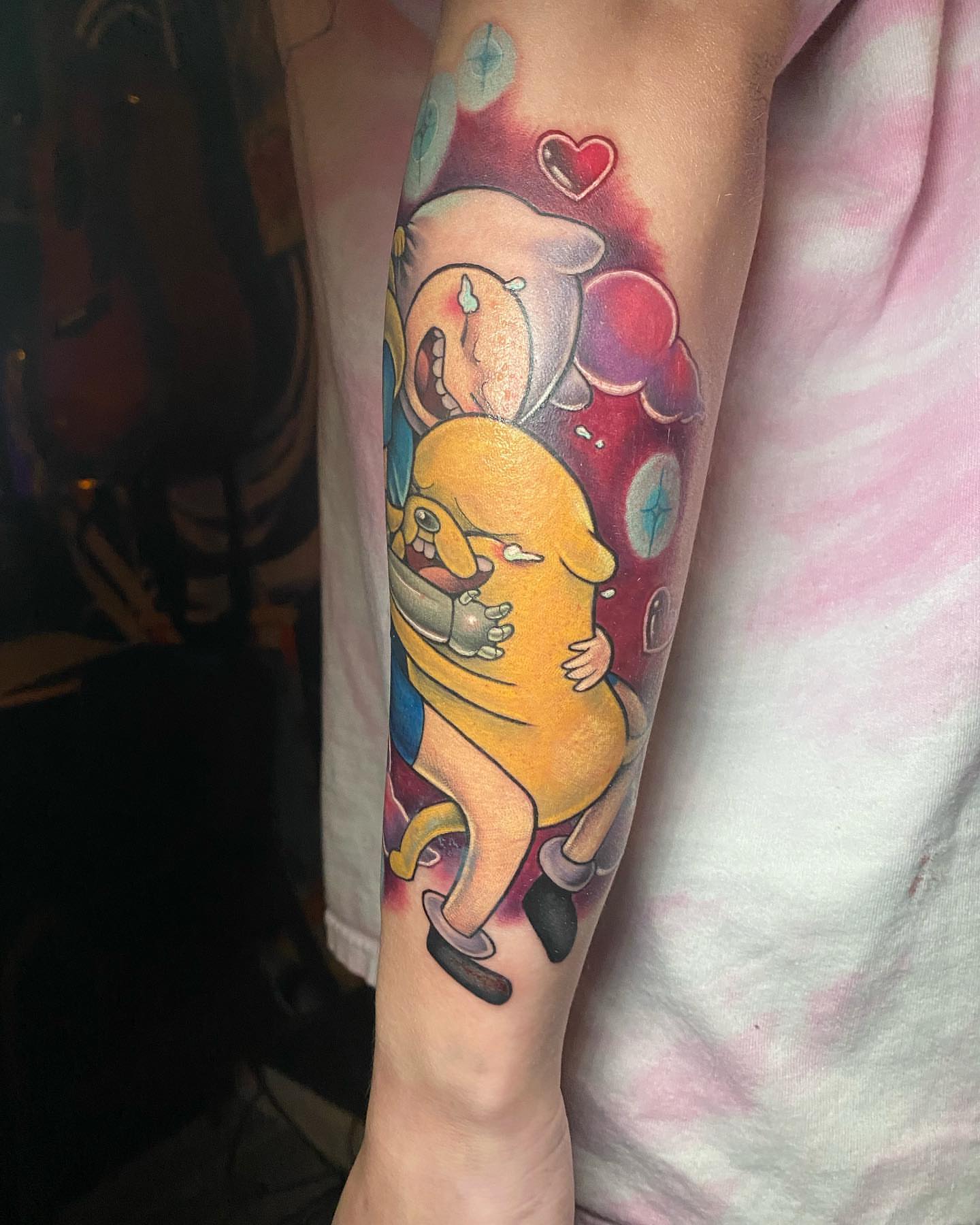 Character with heart dotwork tattoo on the forearm by Tattertot