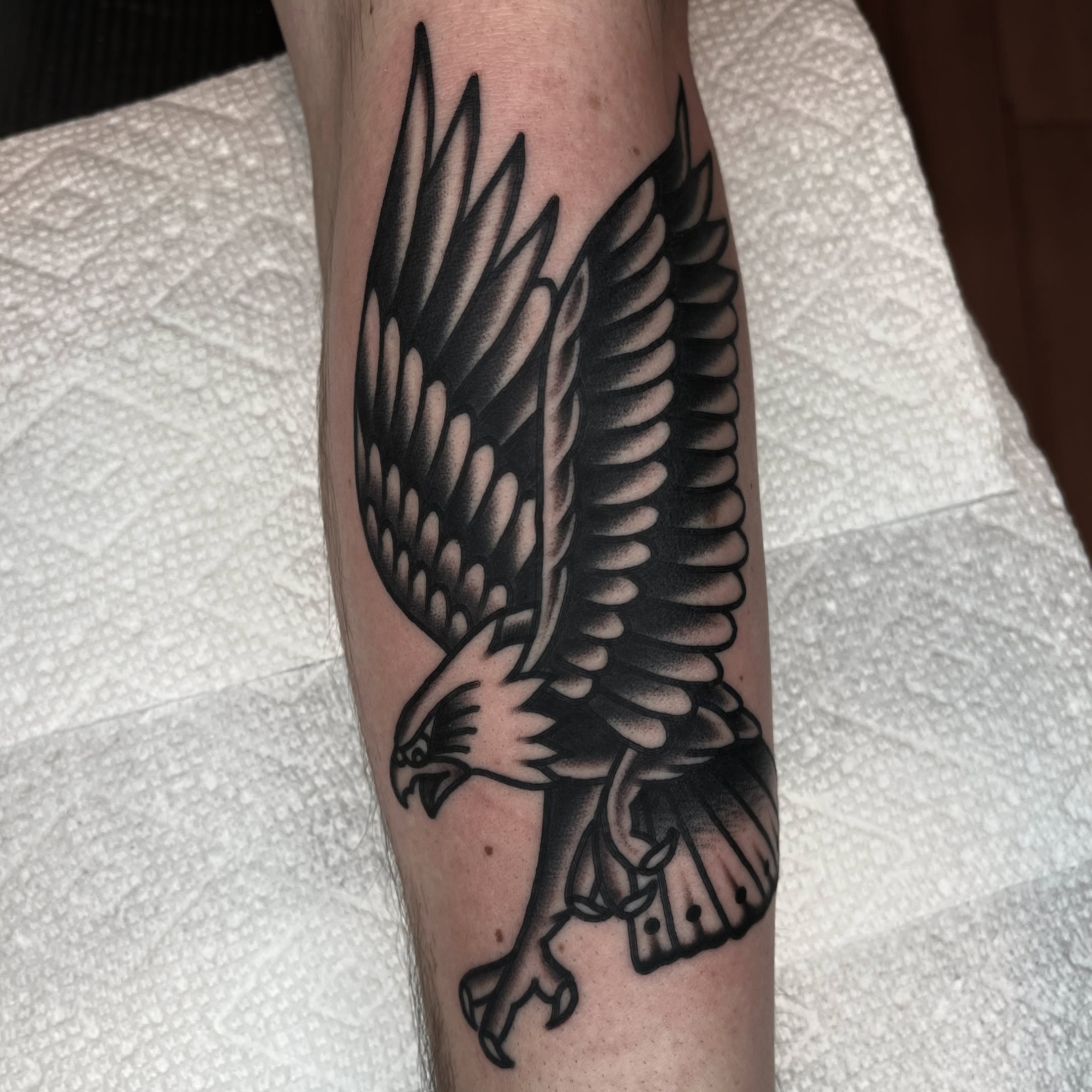 Eagle American traditional tattoo on the forearm by John Lemon