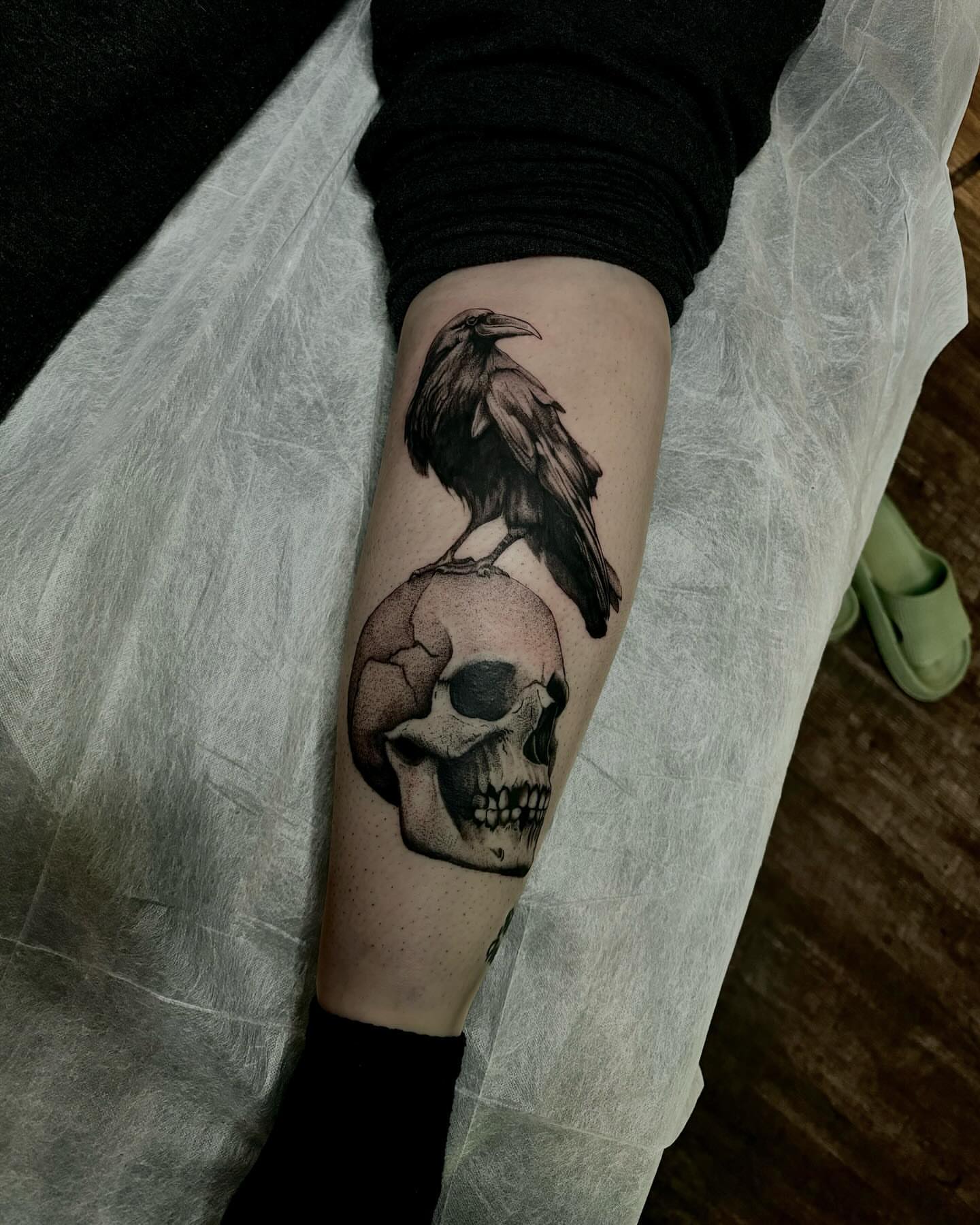 Skull and crow realism tattoo on the forearm by aleah 🌙