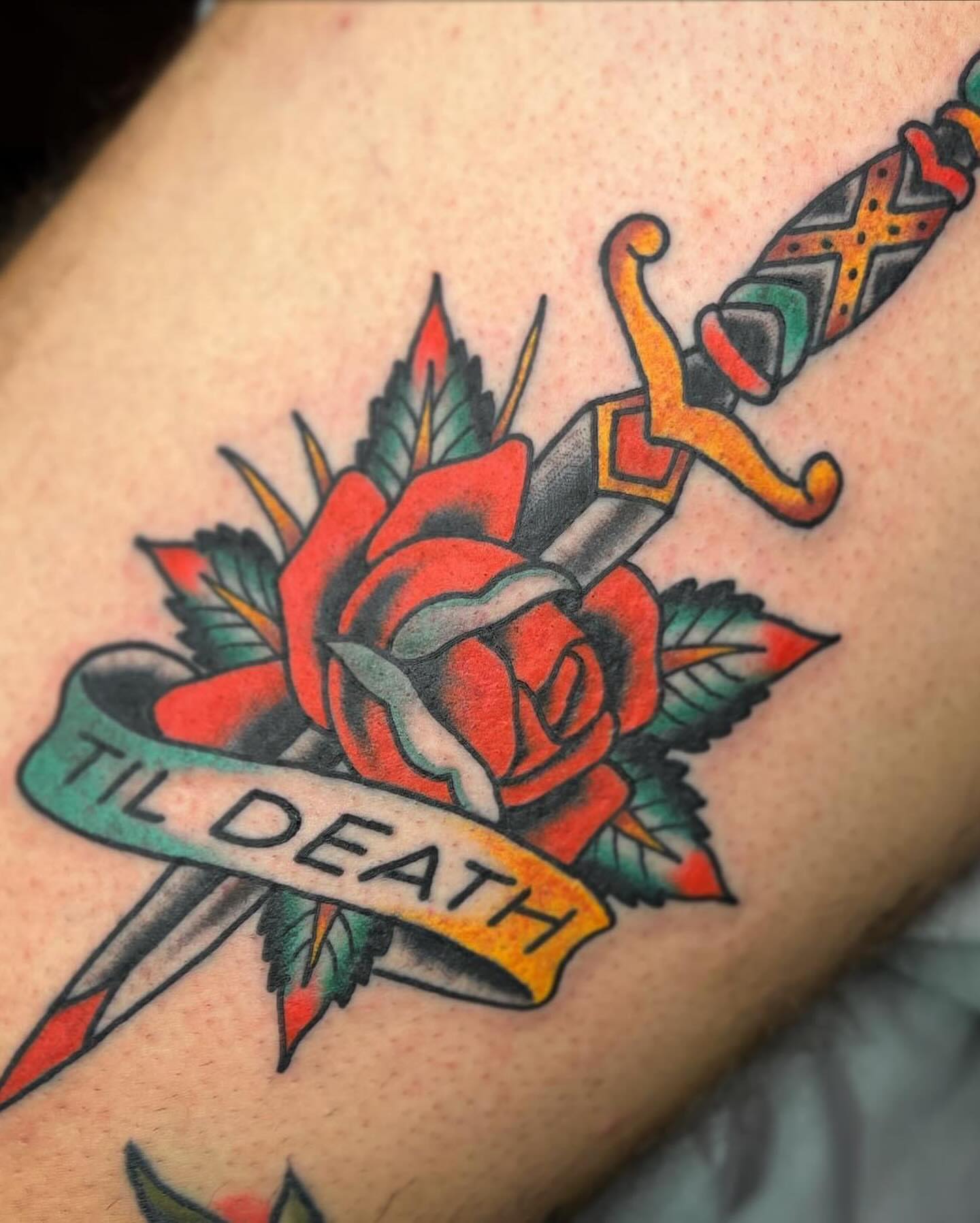 Rose and dagger American traditional tattoo on the forearm by Drew McElveney, Austin, Texas