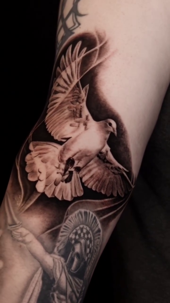 Dove and religious figure realism tattoo by Brandon Rabago, Fort Worth, Texas
