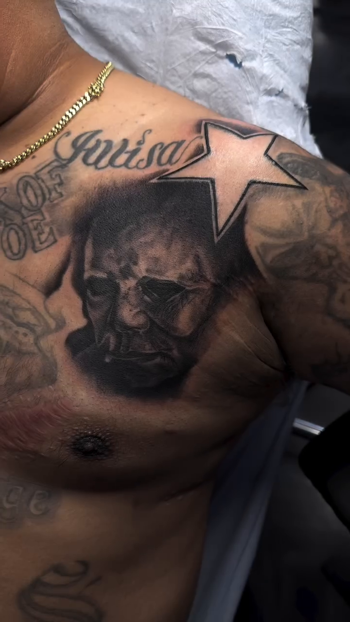 Man's portrait and star realism tattoo by Dani B.
