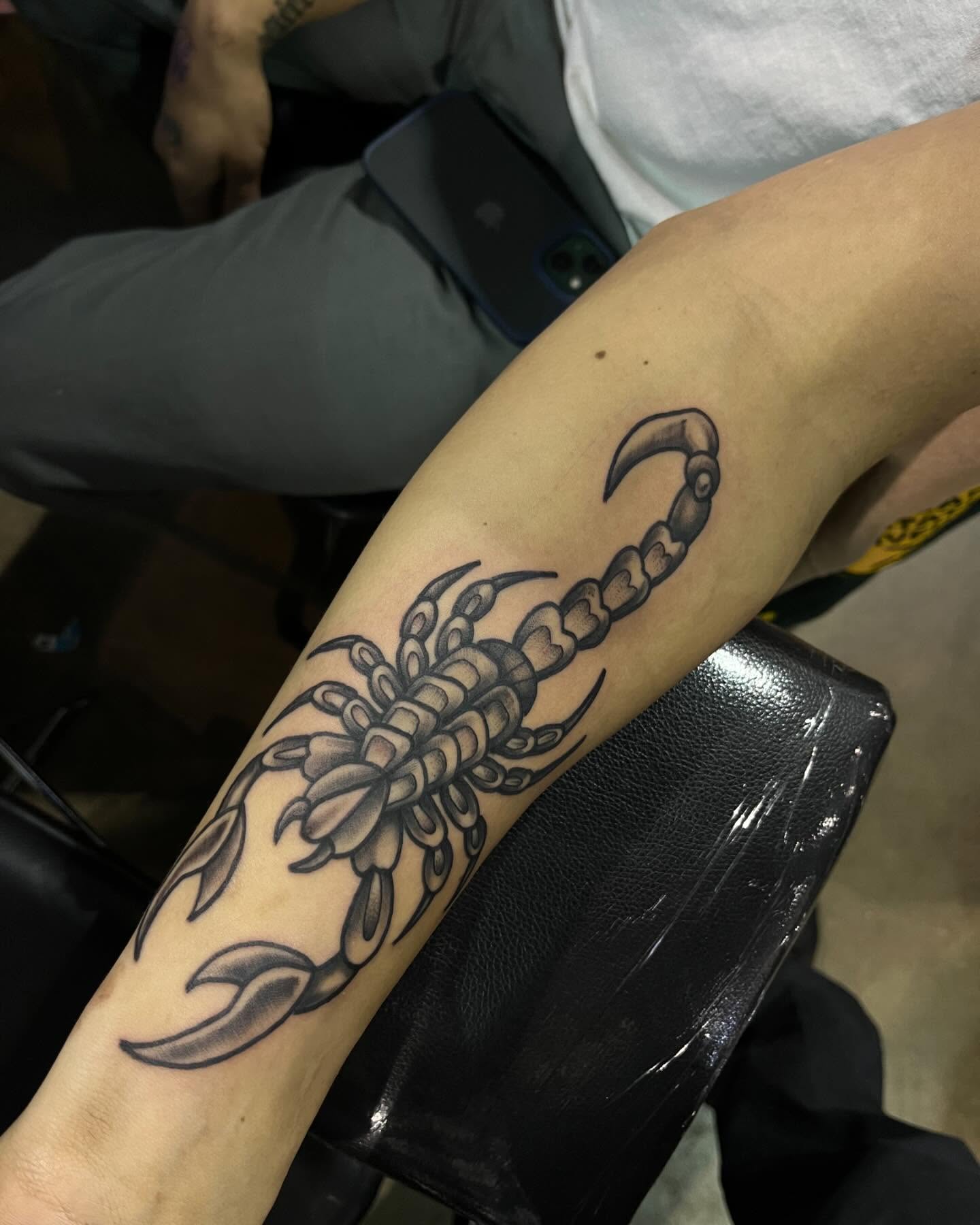 Scorpion black and grey tattoo on the forearm by Morgan Jones