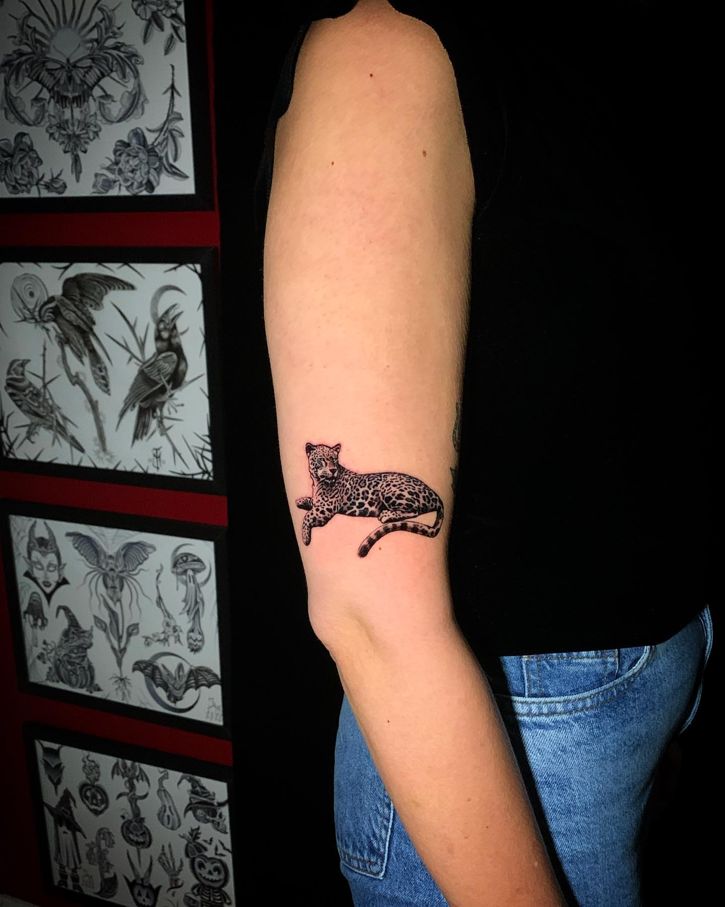 Leopard black and grey tattoo on the forearm by james padelt