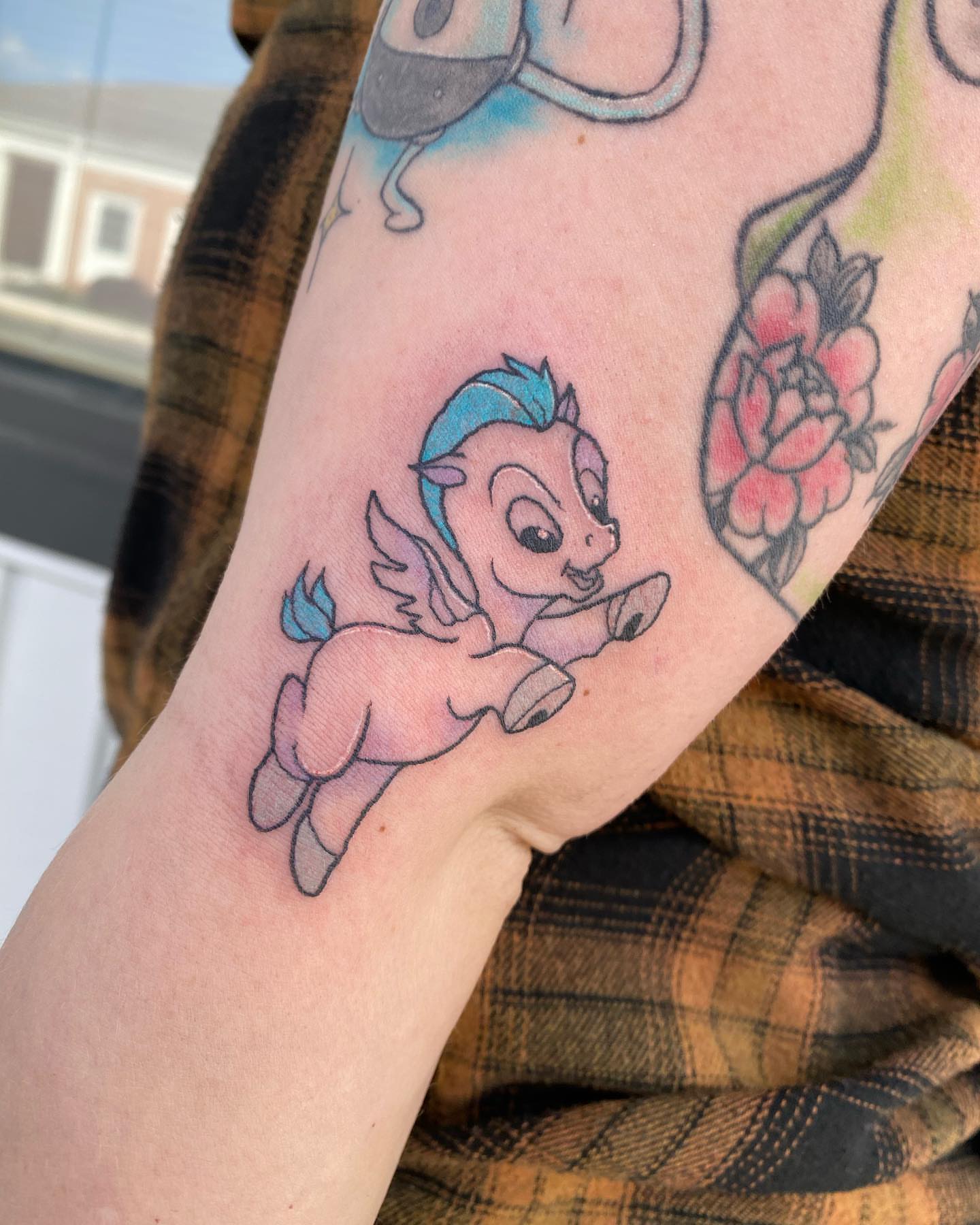 Mythical creature new school tattoo on the forearm by Savanna Starr Mortensen