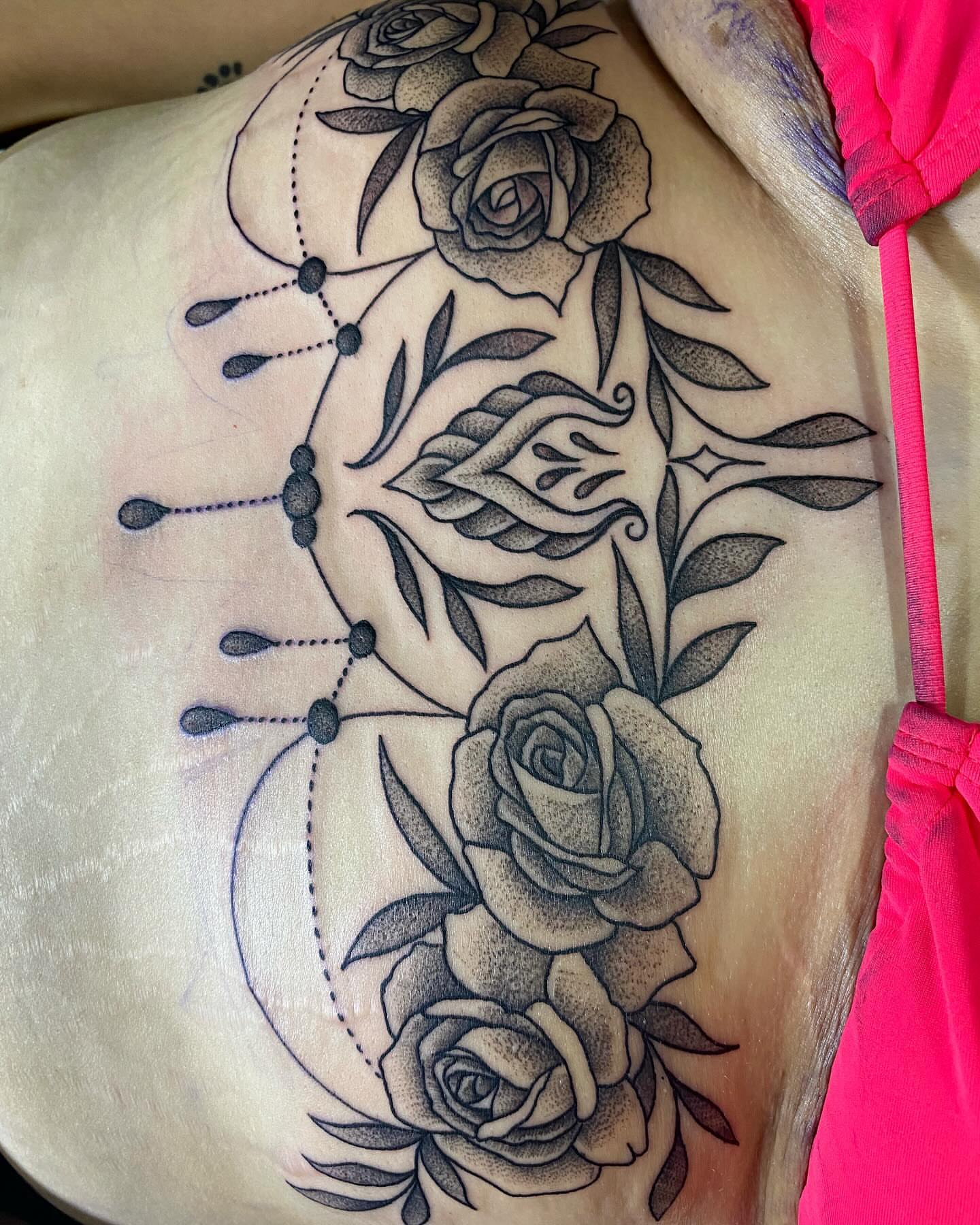 Roses and leaves dotwork tattoo on the shoulder by Taya Lynn, Hudson, Wisconsin