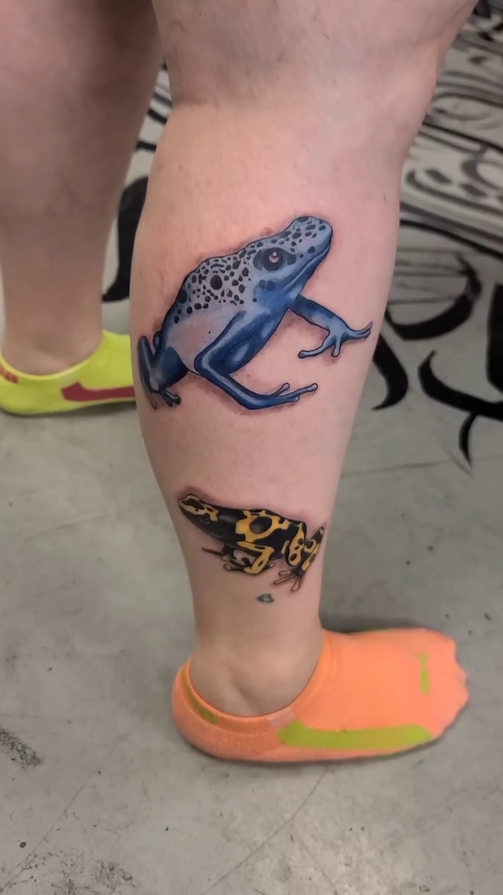 Two poison dart frogs realism tattoo by Chris TL Jones