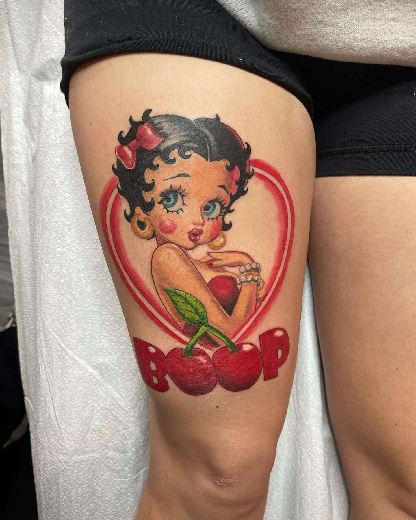 Betty Boop American traditional tattoo on the thigh by Antonio Massimino