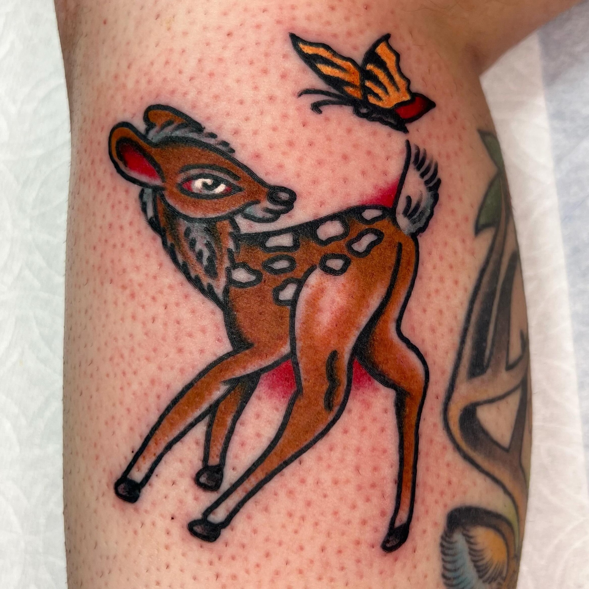 Deer and butterfly American traditional tattoo on the forearm by Clayton - TRADITIONAL TATTOOS