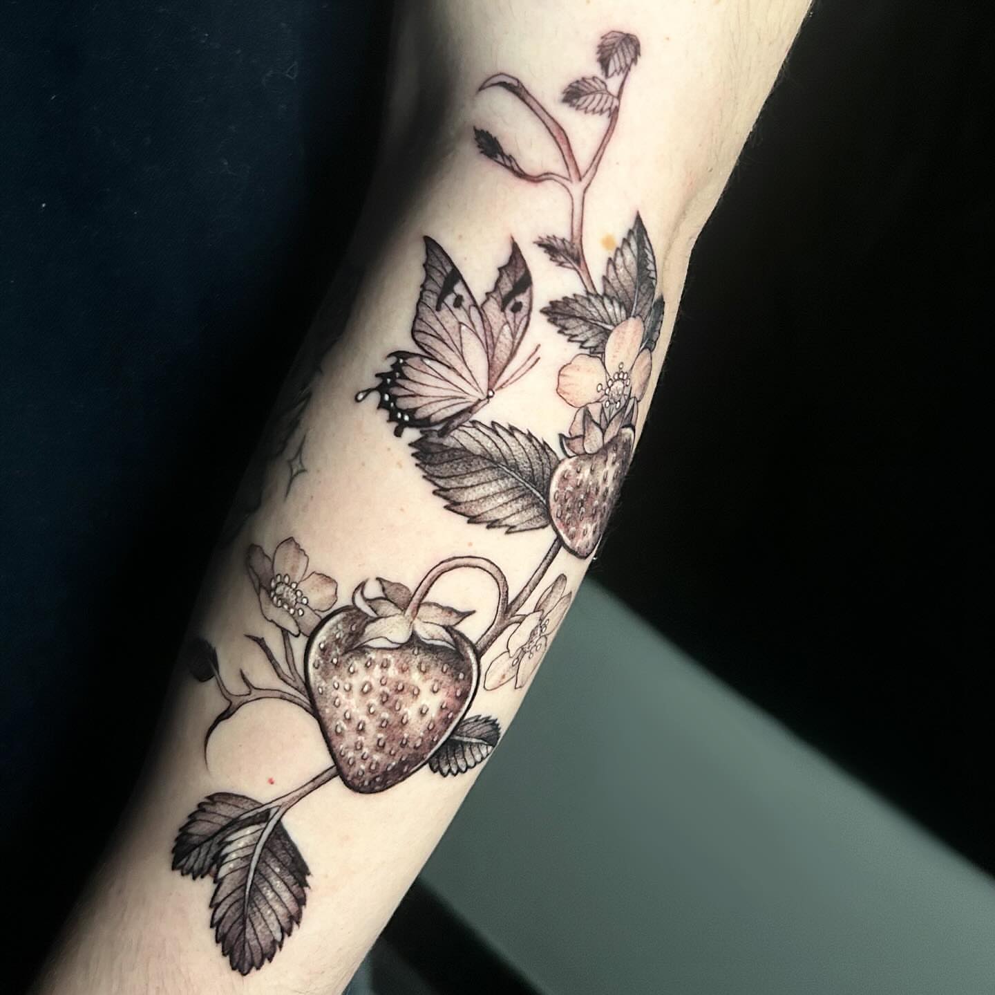 Strawberry and butterfly realism tattoo on the forearm by ♡︎ Kaylie ♡︎, Tacoma, Washington