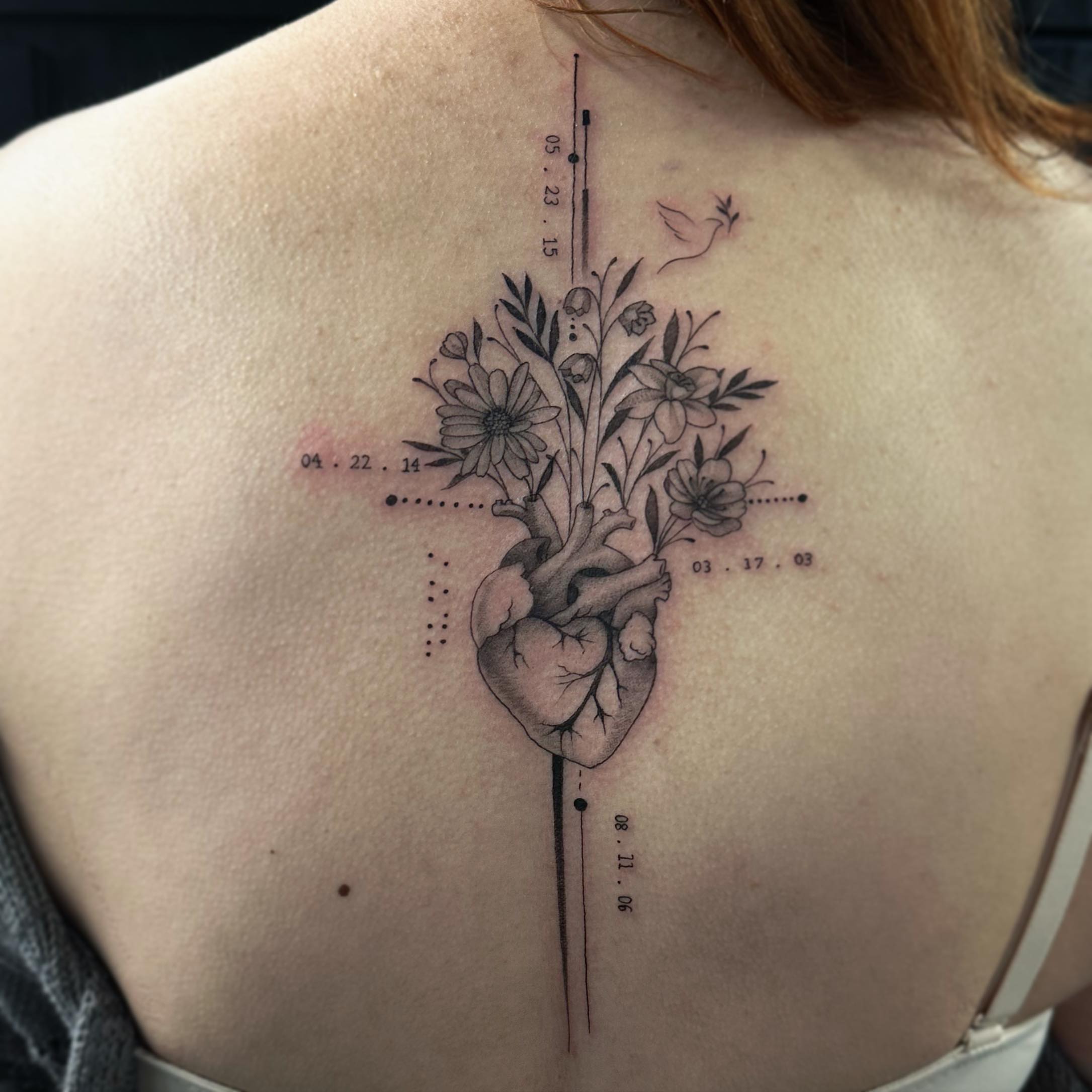 Heart and flowers dotwork tattoo on the back by audi