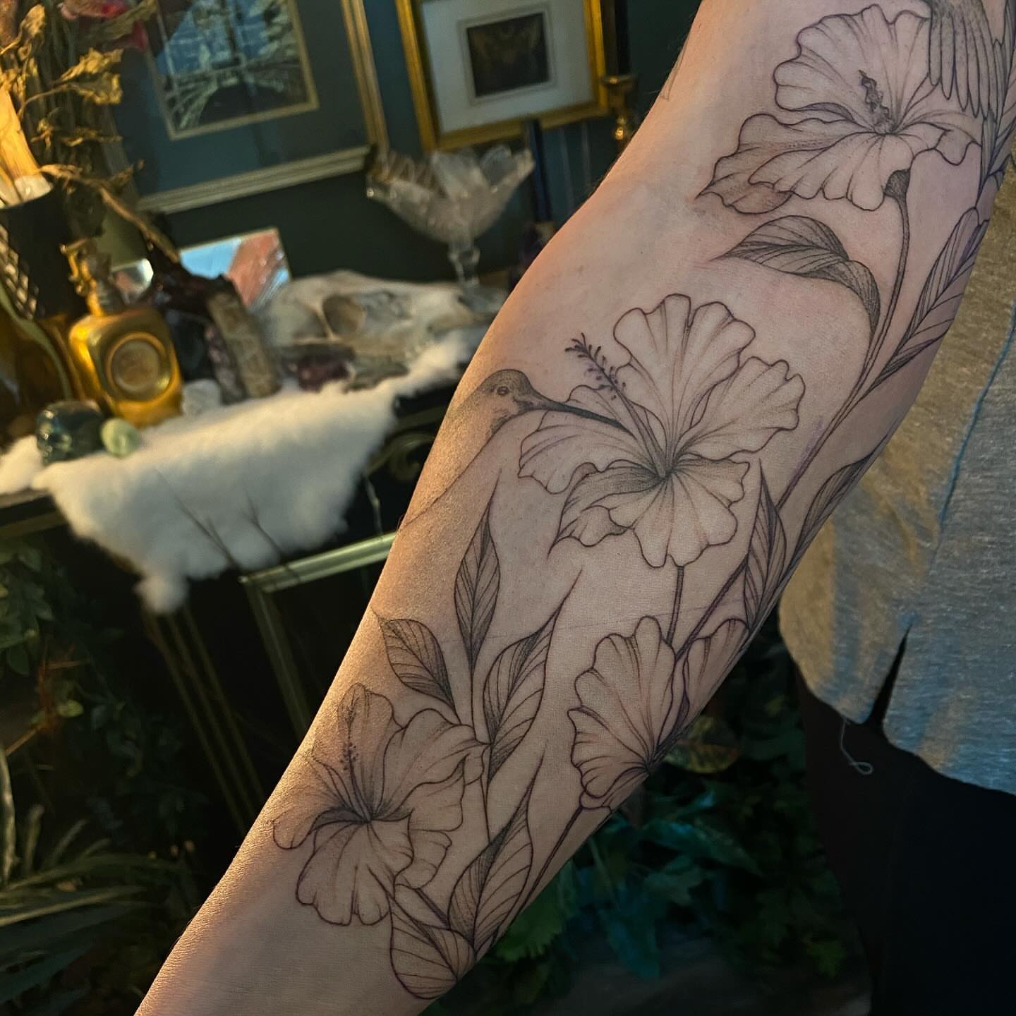 Hawaiian flowers and hummingbird black and grey tattoo on the forearm by π―π²ππΆπ±π¦π¦π€π’π― π₯ πͺπ¦π π₯π¦π€ππ« π±ππ±π±π¬π¬ ππ―π±π¦π°π± πββ¬