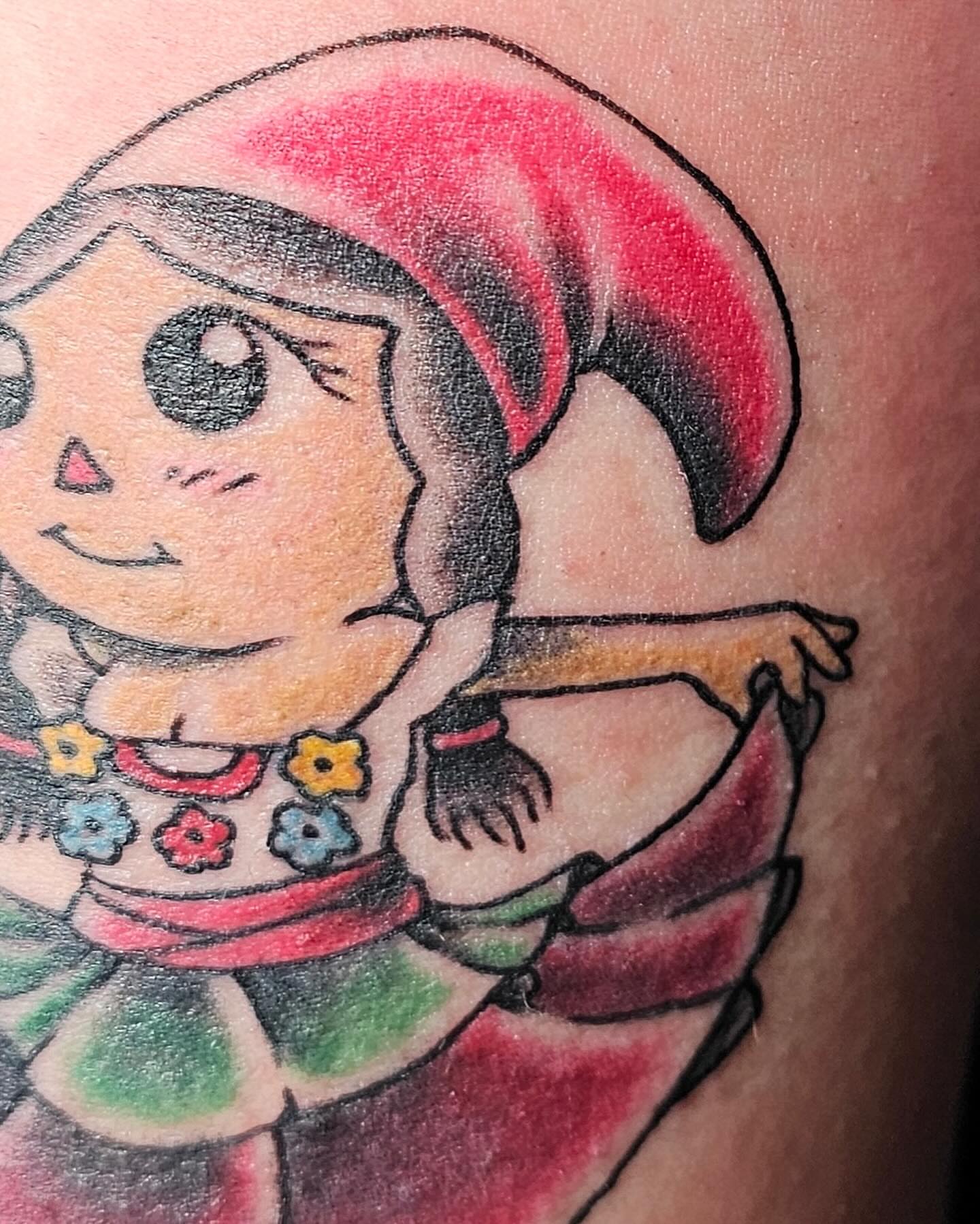 Anime character anime tattoo on the upper arm by J. Arturo Laparra