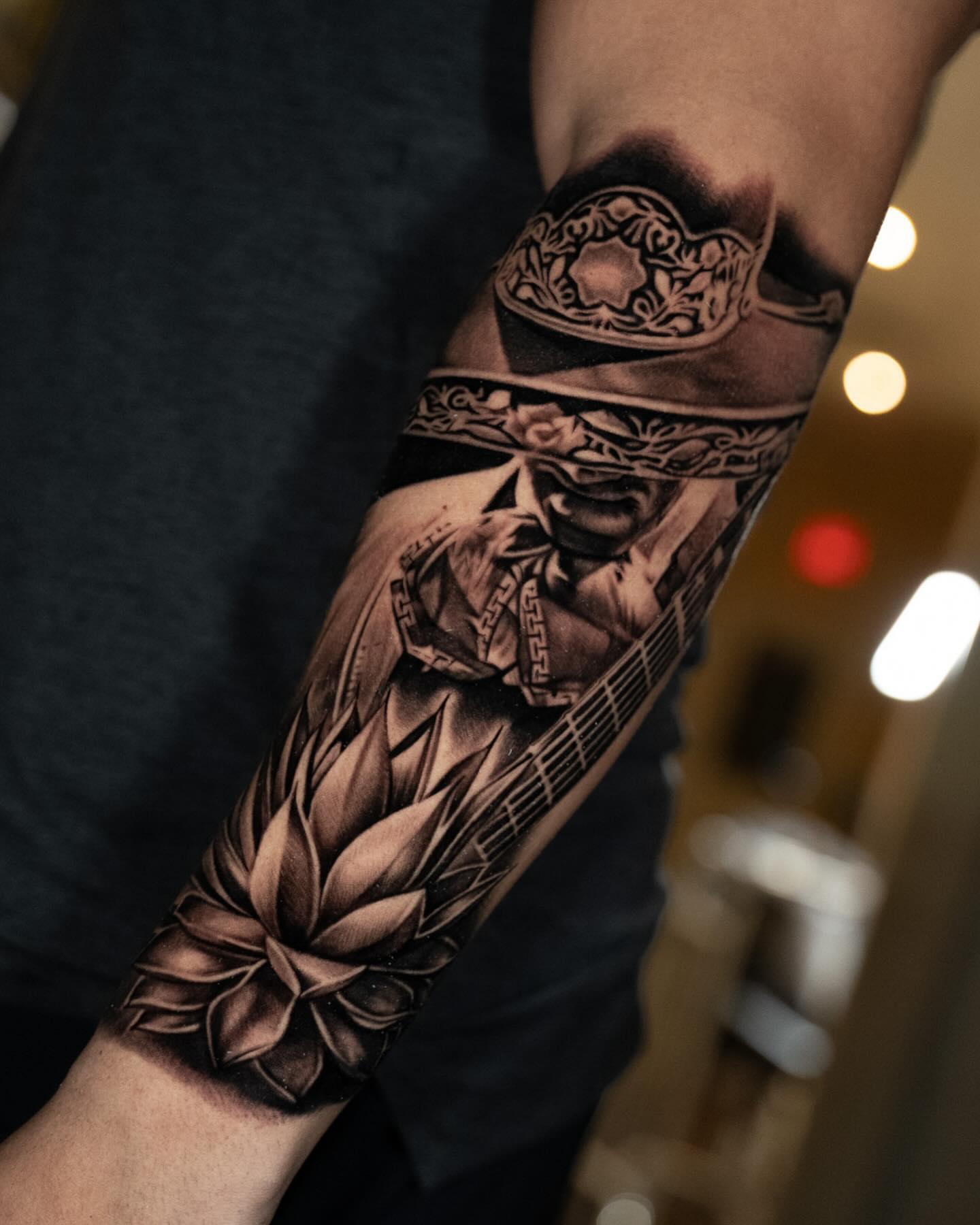 Military helmet and soldier black and grey tattoo on the forearm by Alan Delarosa