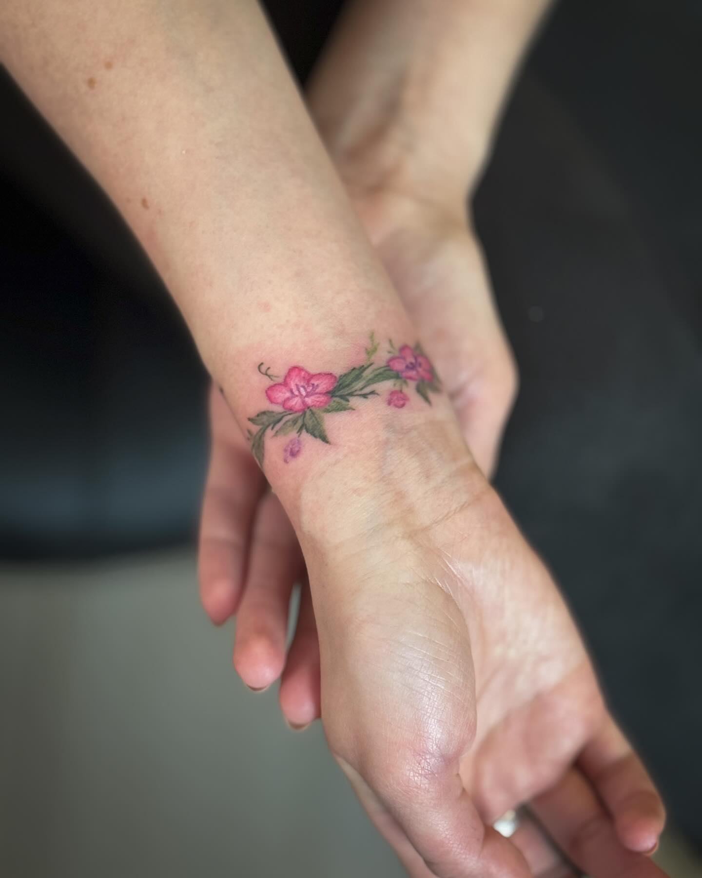 Flowers dotwork tattoo on the forearm by Ksu Storm, San Francisco, California