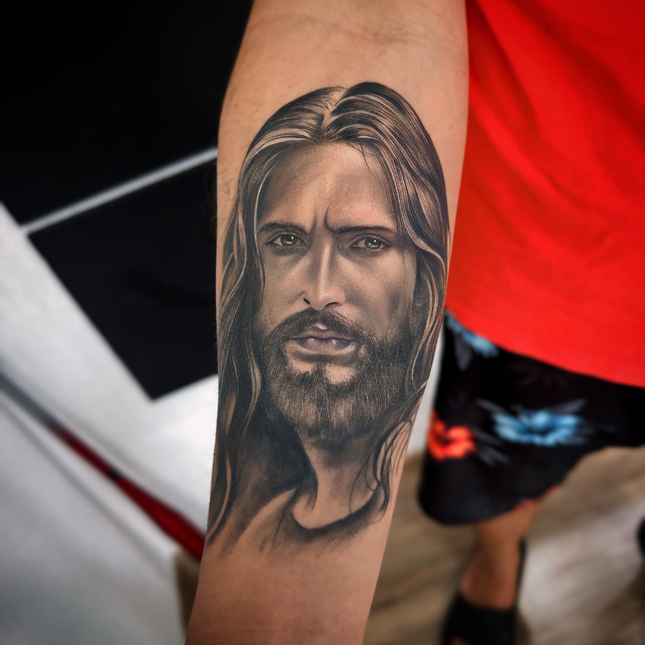 Portrait realism tattoo on the forearm by Tattoo Artist - the Goat