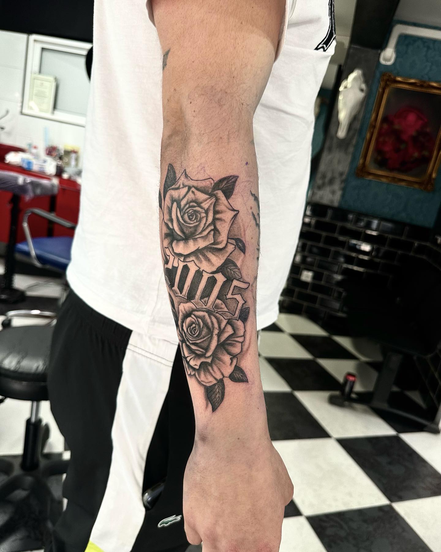 Roses realism tattoo on the forearm by Kunaytattoo
