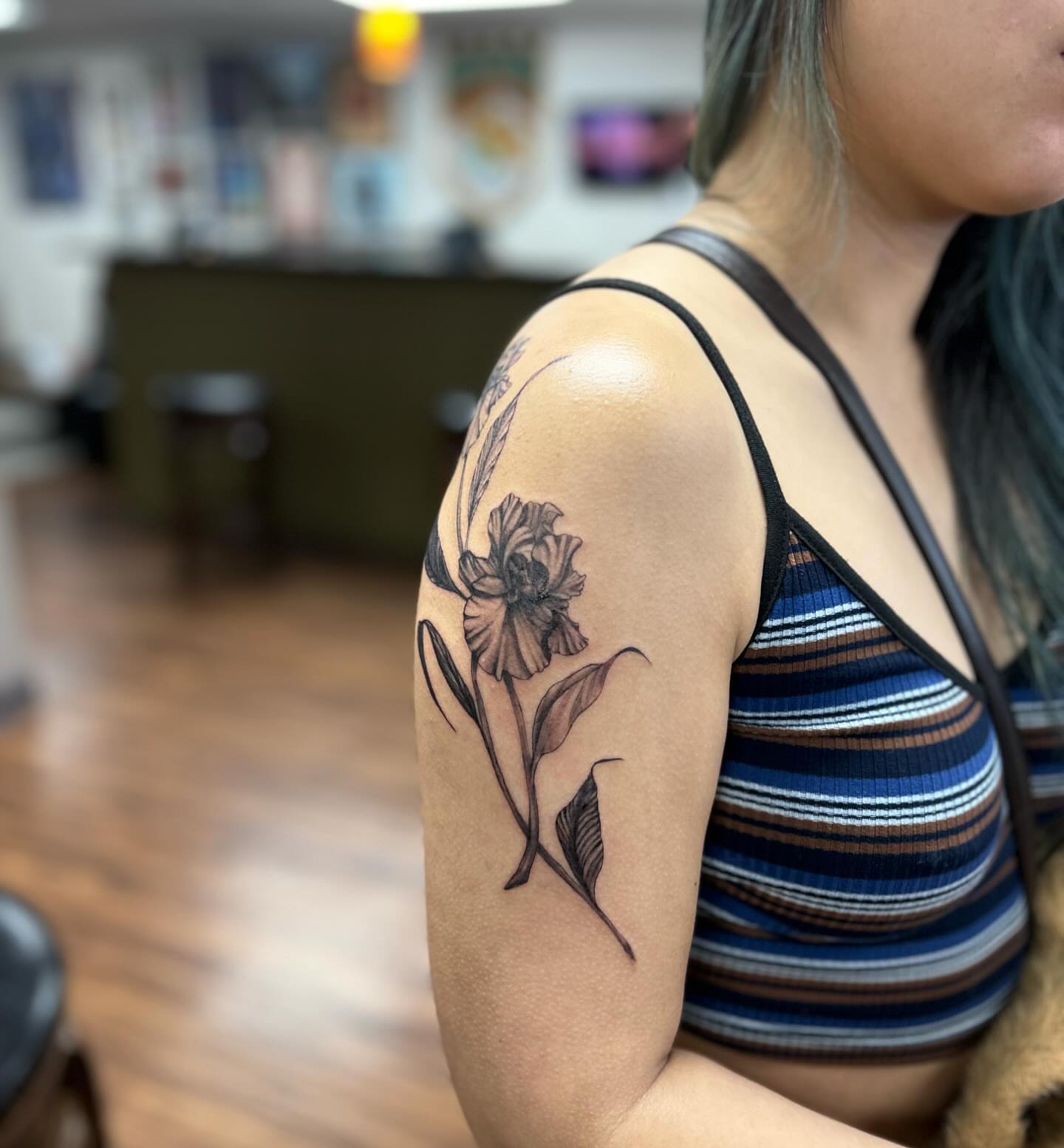 Flower black and grey tattoo on the shoulder by Brittany Brutal