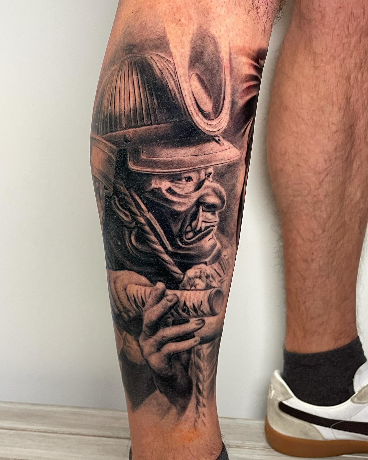 Astronaut realism tattoo on the calf by Justin Reid, San Jose, California