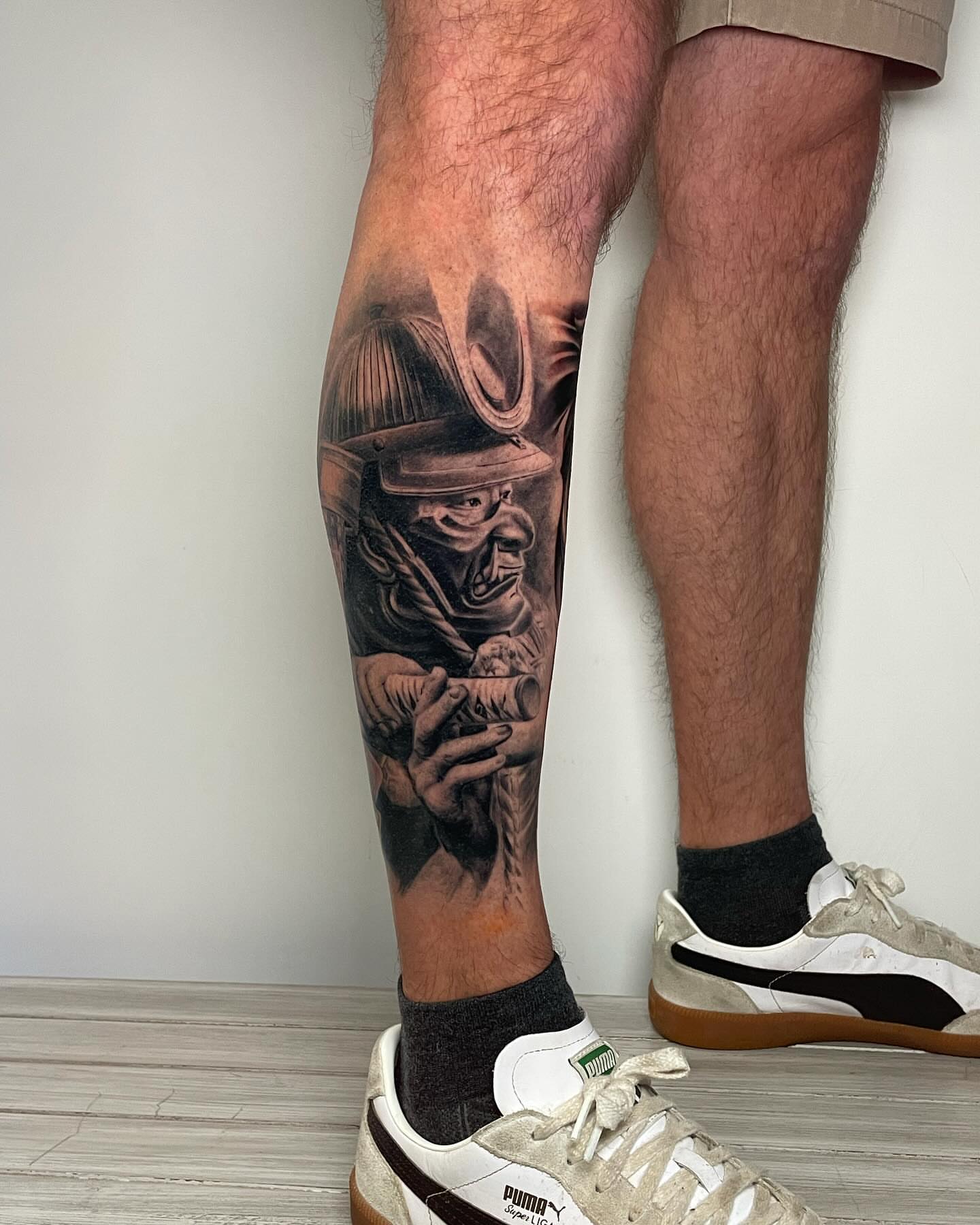 Firefighter realism tattoo on the calf by Justin Reid, San Jose, California
