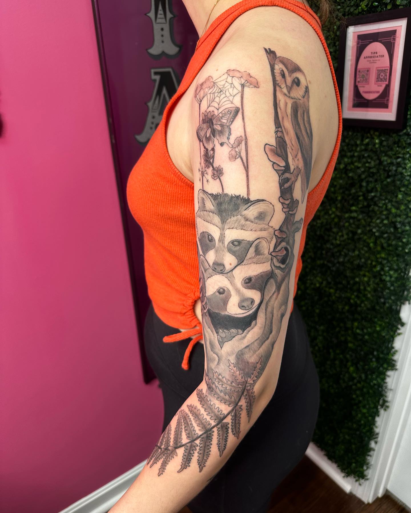 Raccoon and owl realism tattoo on the forearm by Jakki Hicks