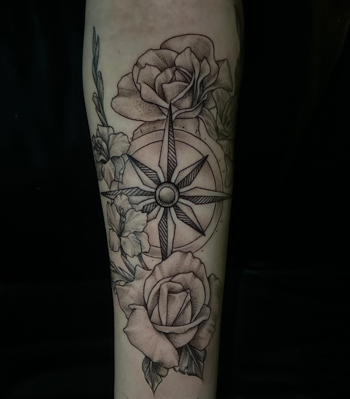 Compass and roses realism tattoo on the forearm by Dustin Lane Collins