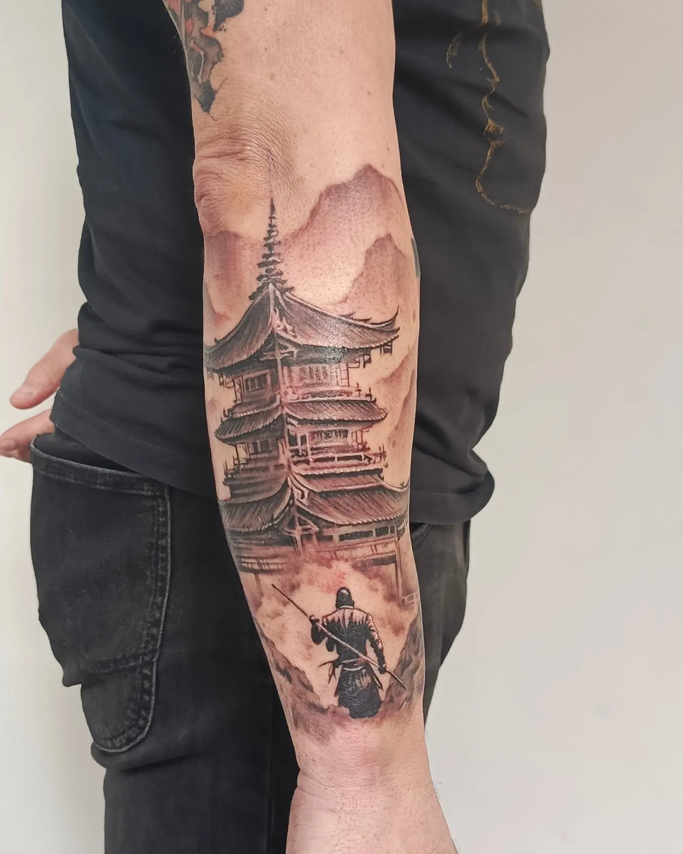 Ancient temple and warrior realism tattoo on the forearm by Lindsay