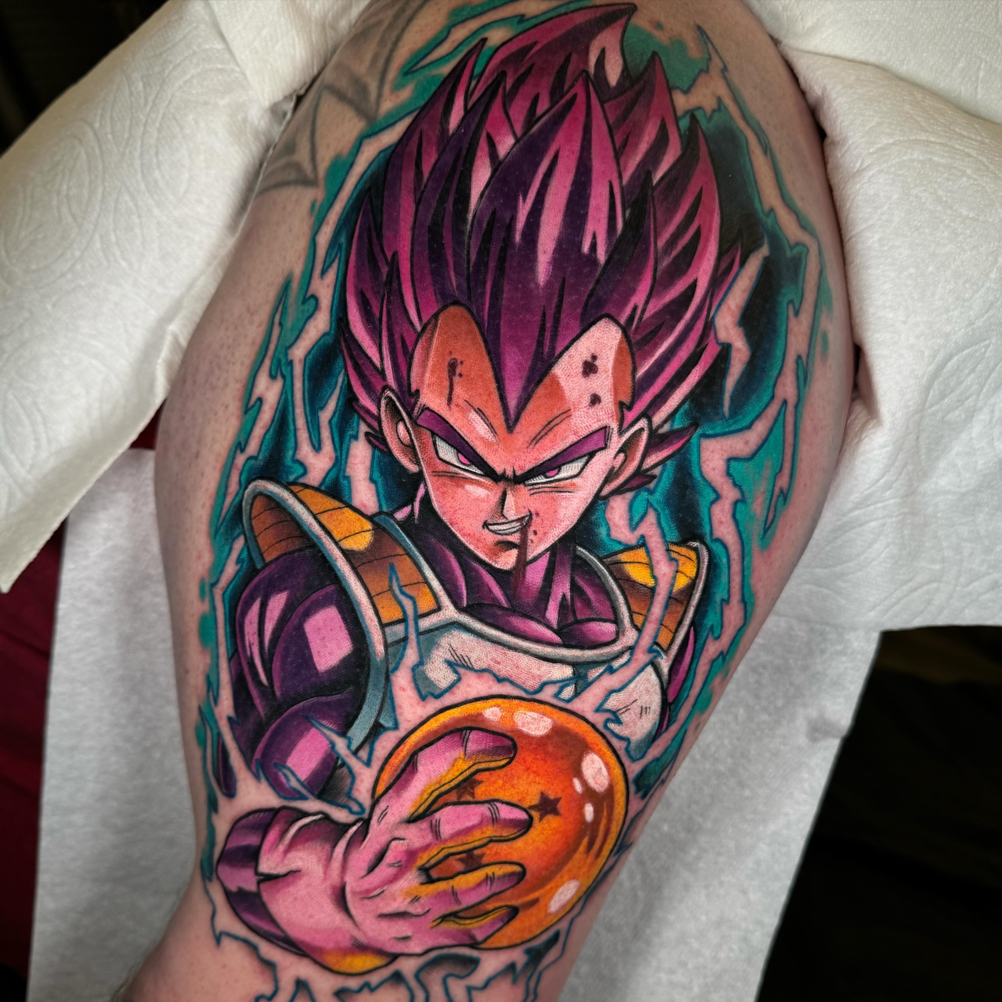 Vegeta anime tattoo on the upper arm by Jon Leighton