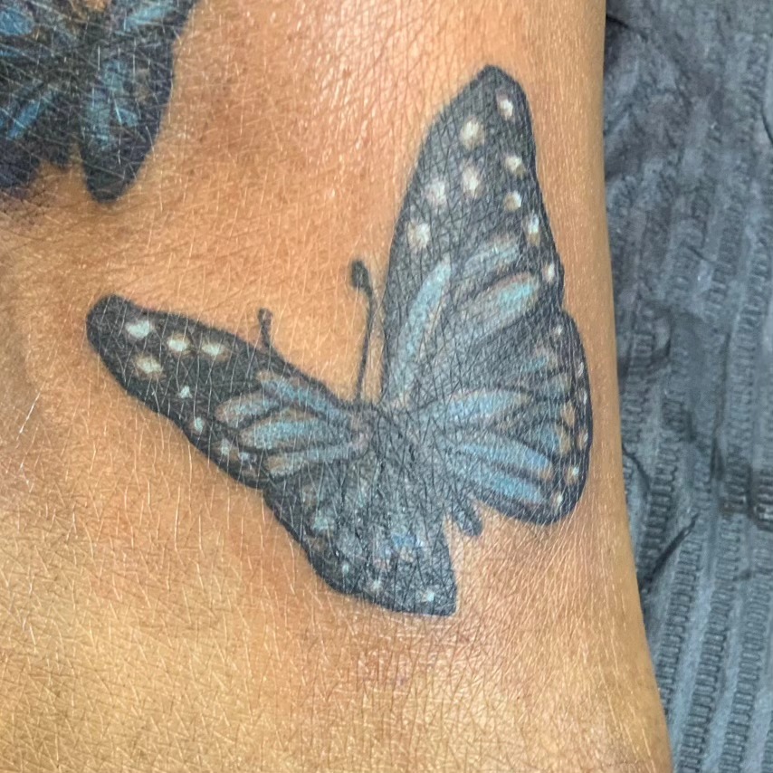 Butterfly fine line tattoo on the forearm by Lopez Dautruche