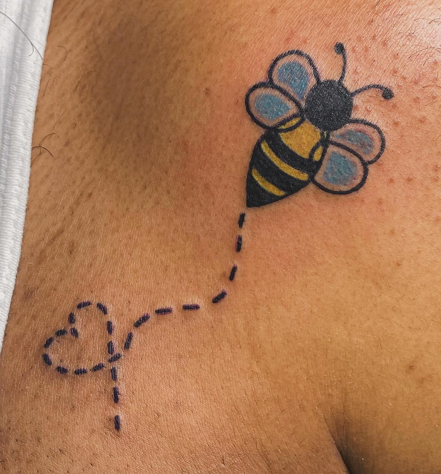 Bee dotwork tattoo on the upper arm by Tiffany