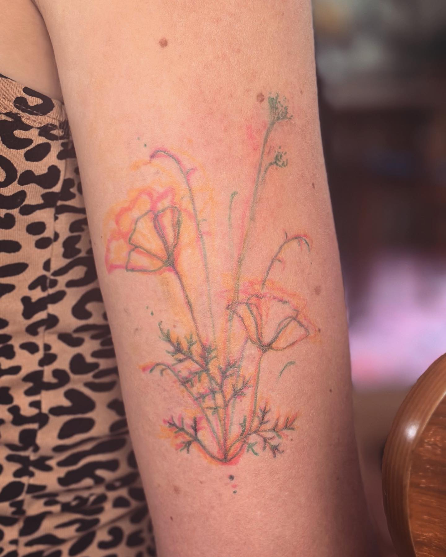 Flowers watercolor tattoo on the forearm by Gaya