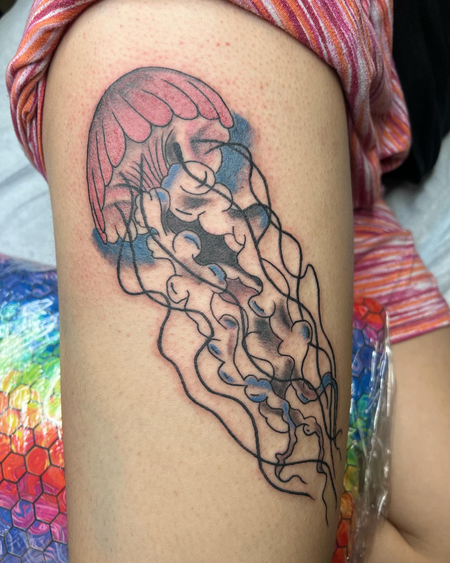 Jellyfish realism tattoo on the thigh by Kai