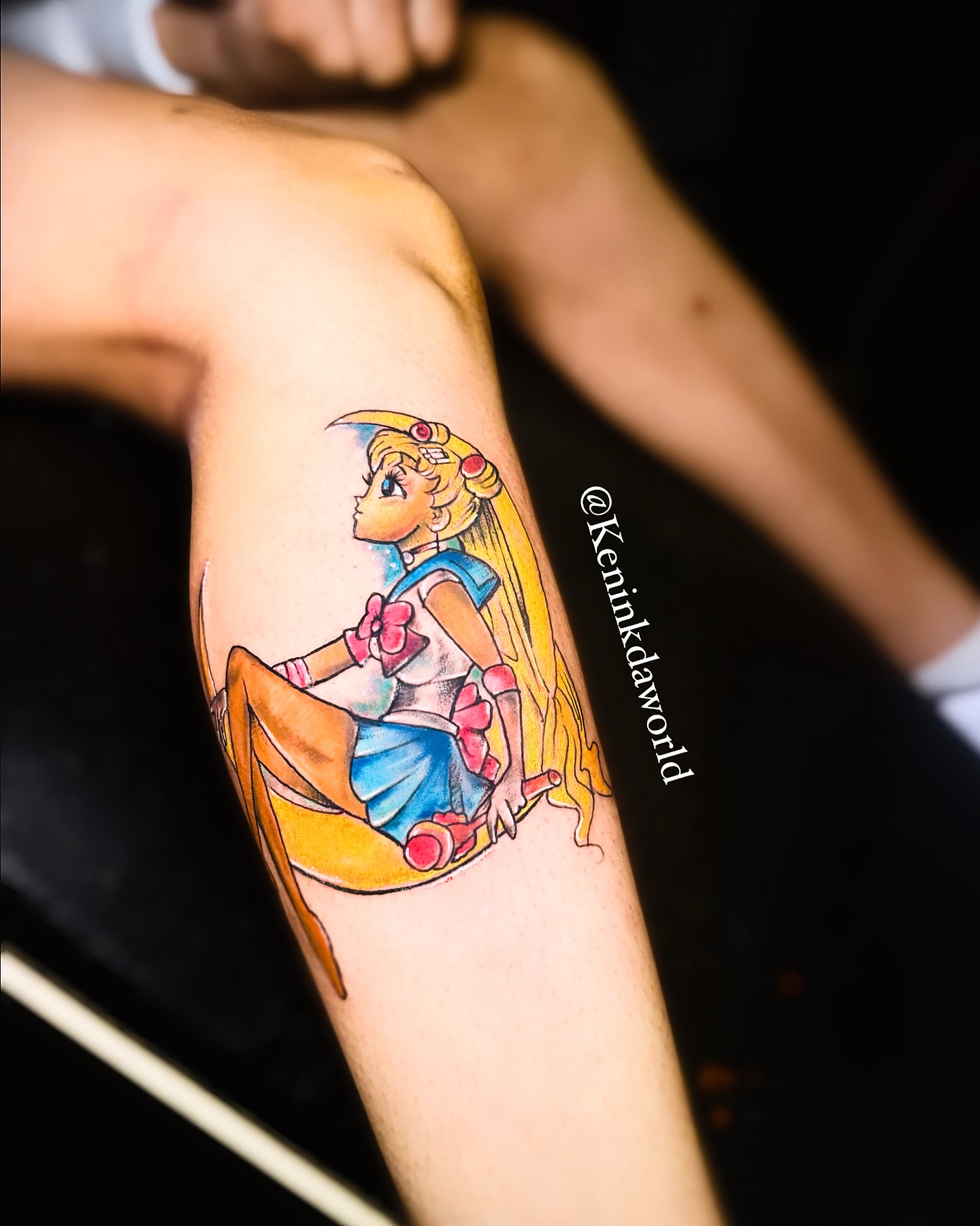 Anime character anime tattoo on the forearm by Ken West