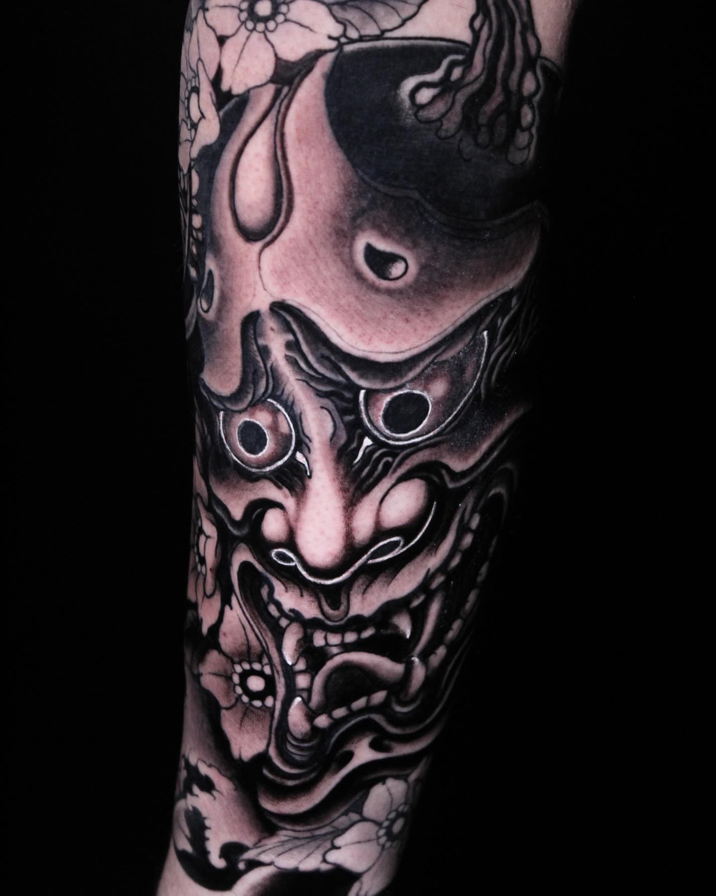 Demon mask realism tattoo on the forearm by Alezumie