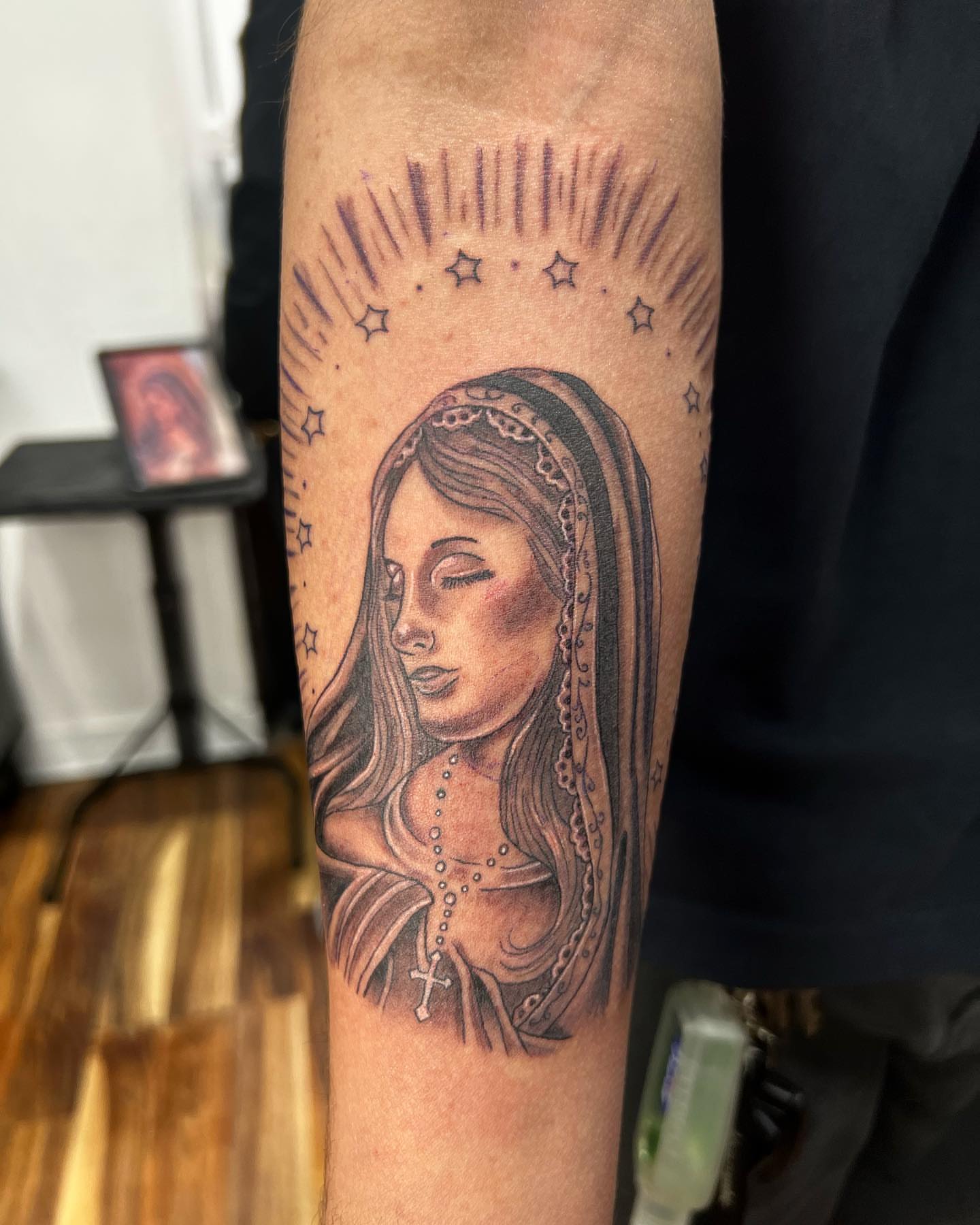 Religious figure realism tattoo on the forearm by Eduardo Chaparro