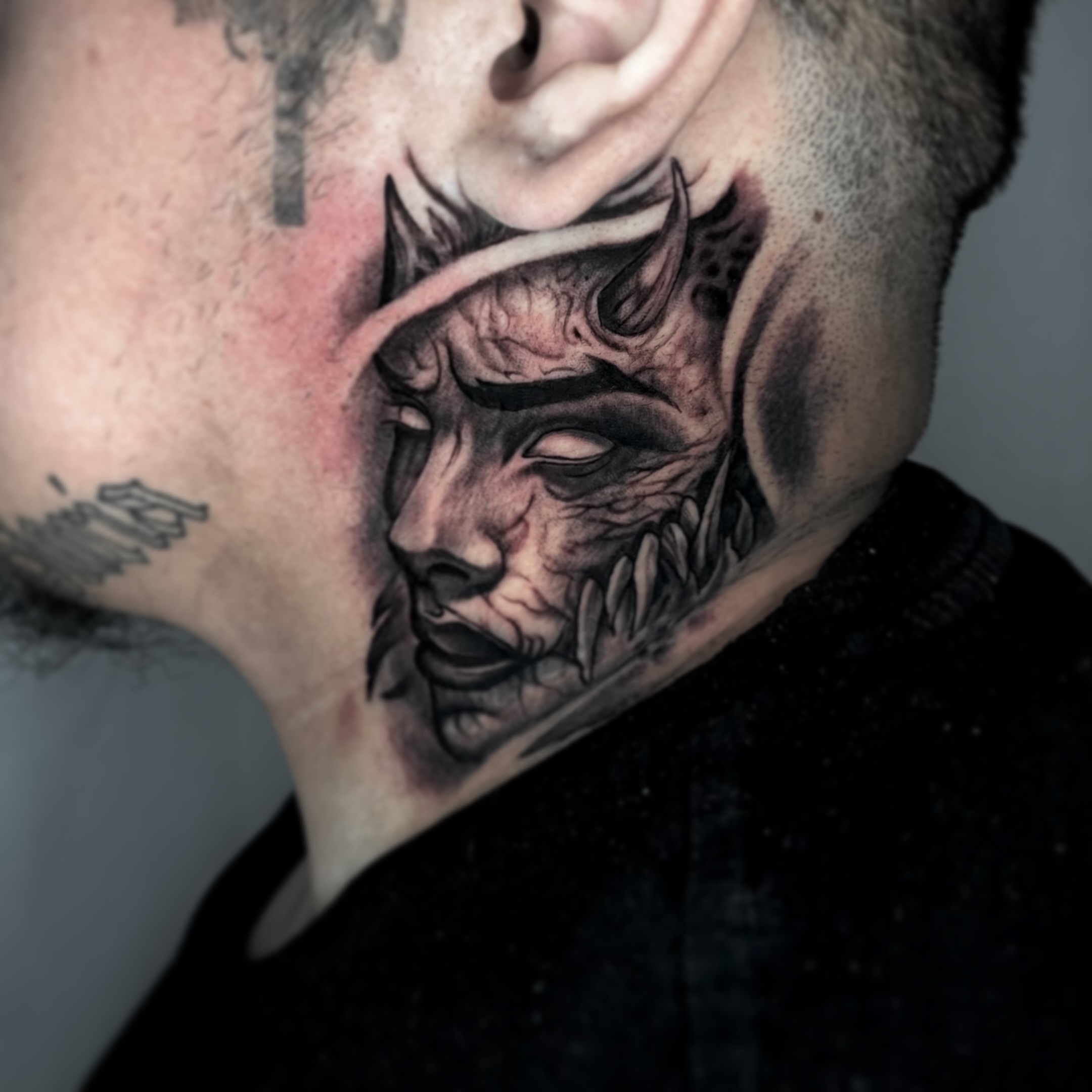 Demon face dark realism tattoo on the neck by Angie Morales, Laredo, Texas