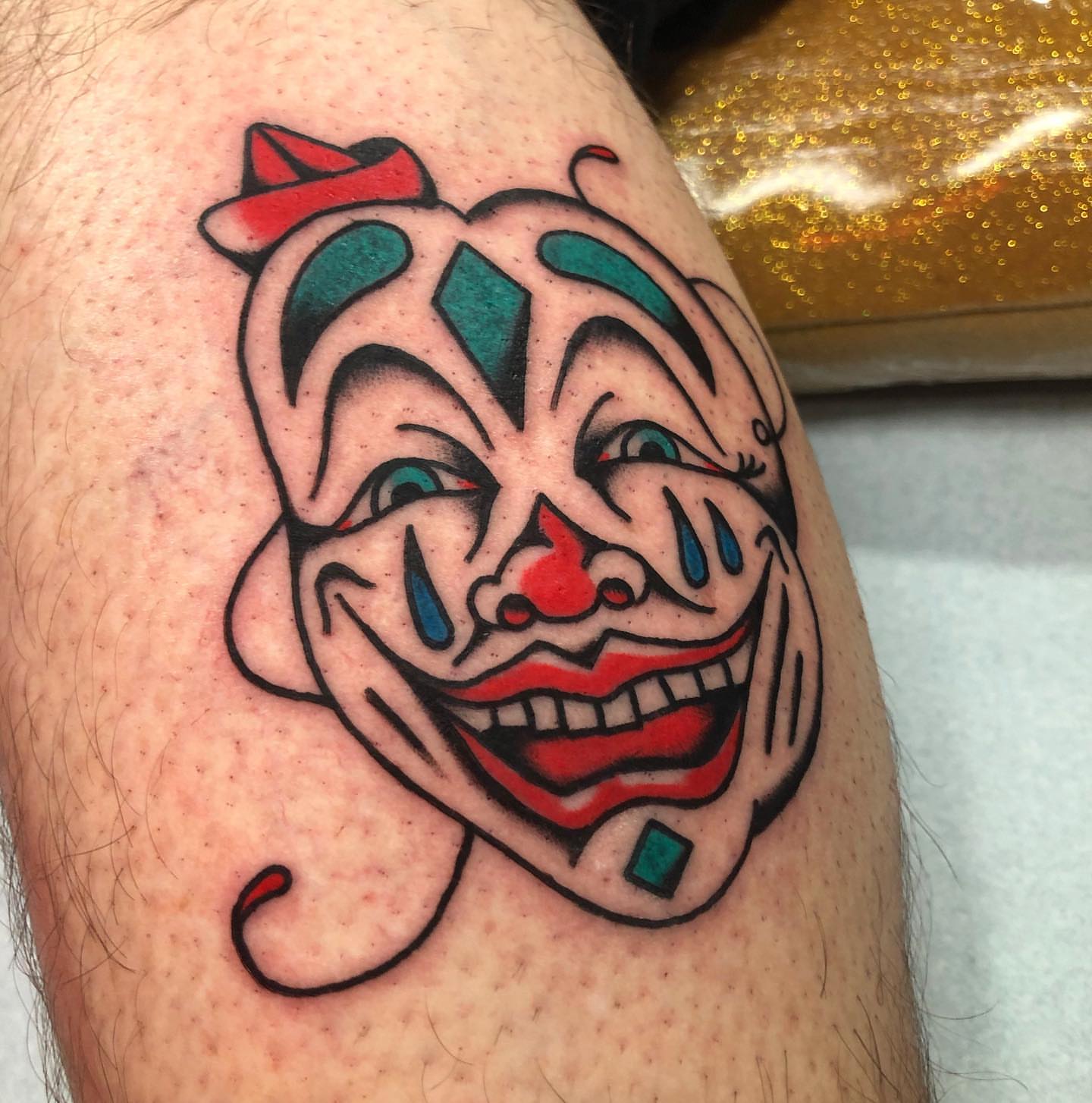 Clown face American traditional tattoo on the forearm by brenden