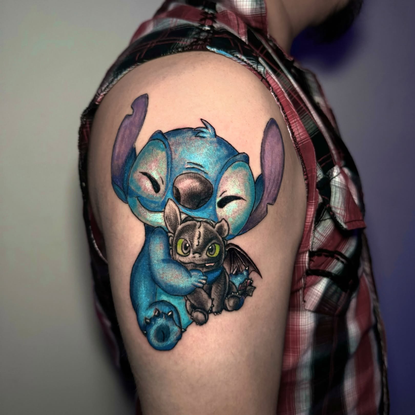 Stitch and Toothless realism tattoo on the shoulder by Dallas Tattoo Artist