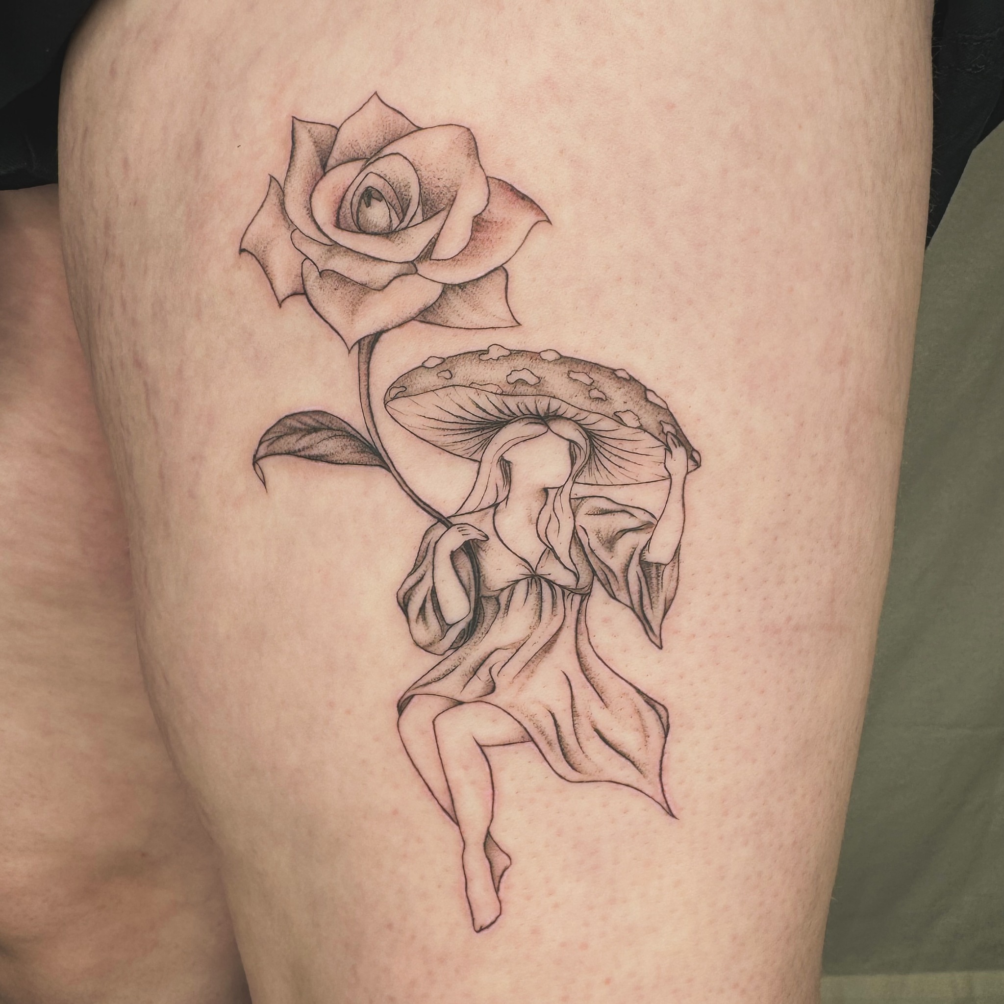 Mushroom and woman realism tattoo on the thigh by RyAnn Lynn