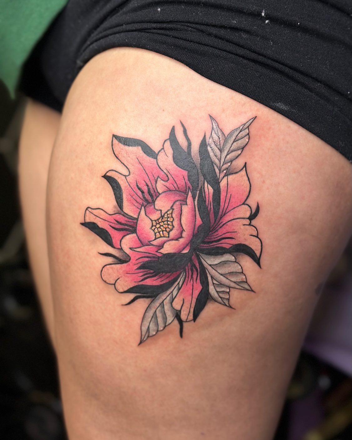 Peony American traditional tattoo on the thigh by Erika Nambo