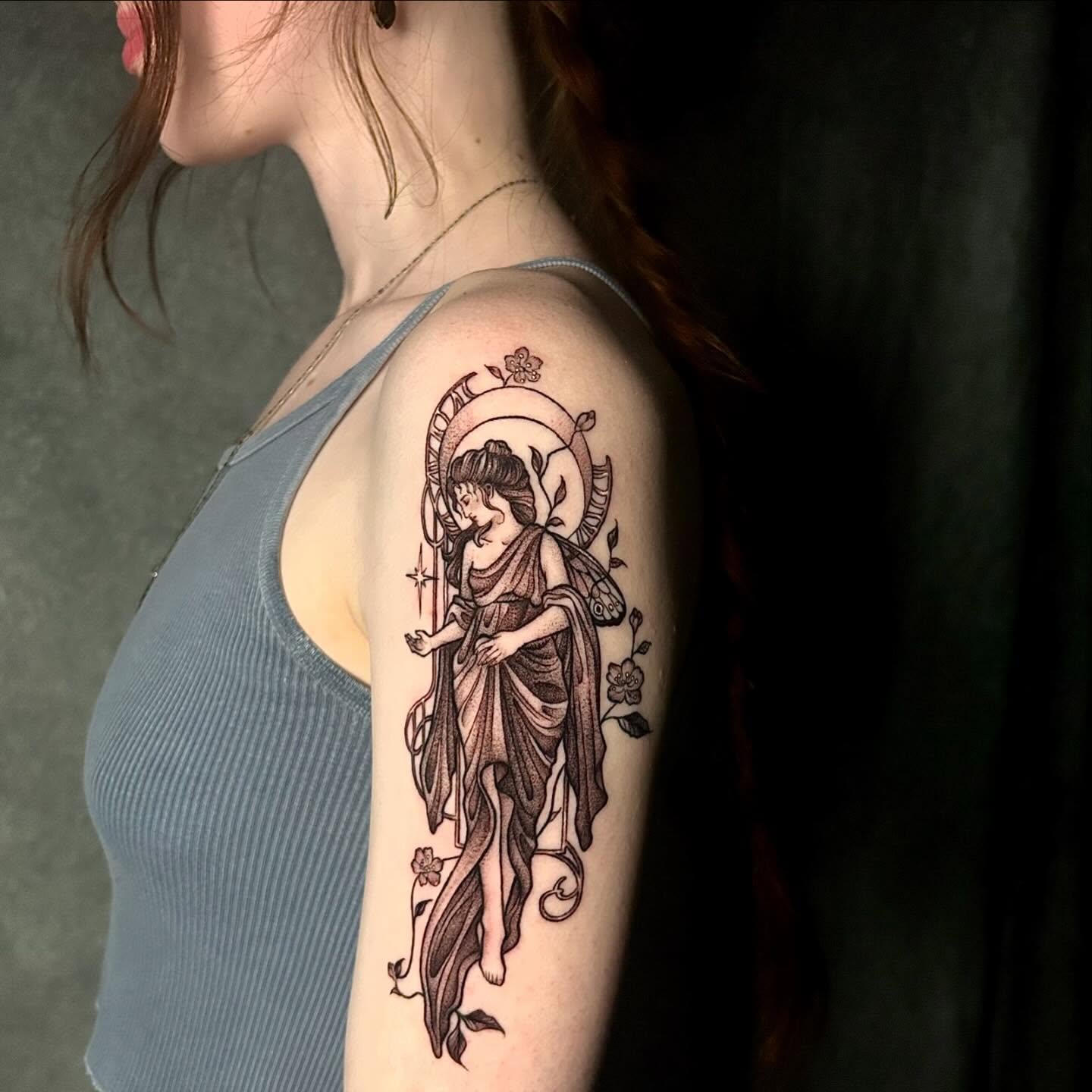 Angelic figure black and grey tattoo on the upper arm by ♡︎ Kaylie ♡︎, Tacoma, Washington