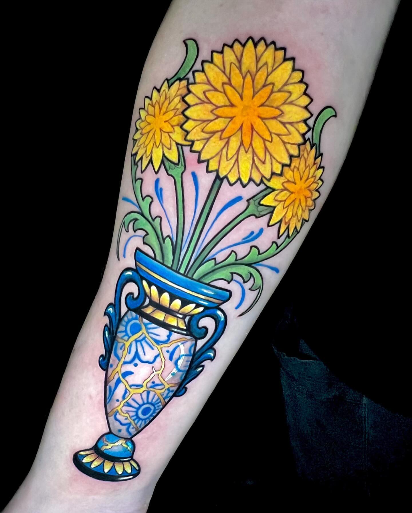 Yellow flowers in vase American traditional tattoo on the forearm by Cortney Norton