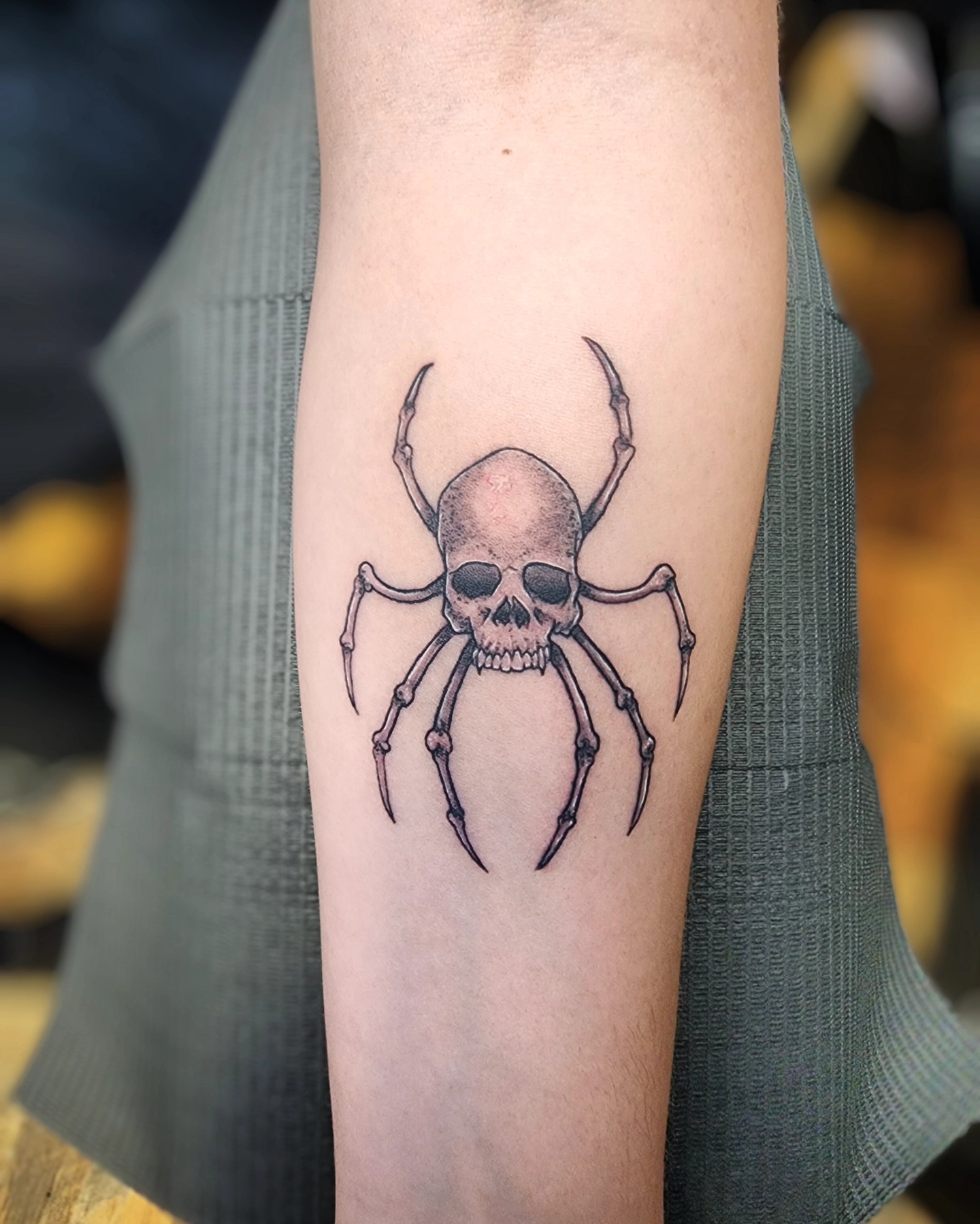 Skull black and grey tattoo on the forearm by Bry True
