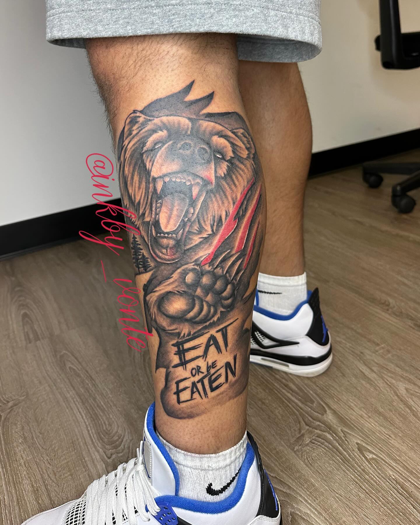Bear realism tattoo on the calf by Vonte Seay