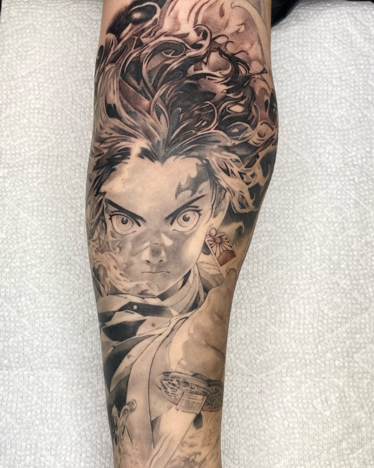 Tattoo by @brawdertattoo — anime, realism