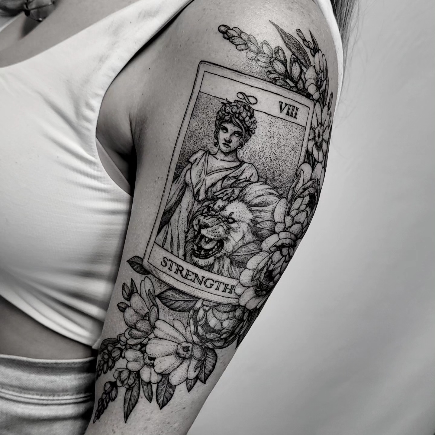 Strength tarot card dotwork tattoo on the forearm by Matthew Barnett